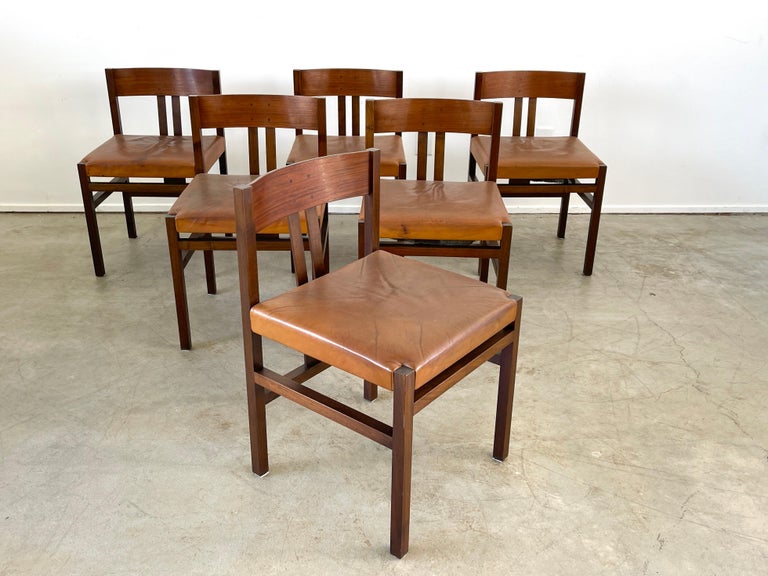 Set of 6 walnut wood dining chairs by Ammanati Titina & Calves Giampiero. 
Wonderful patina to wood and skai leather seats 
Simple geometric design 
Italy, circa 1960s.