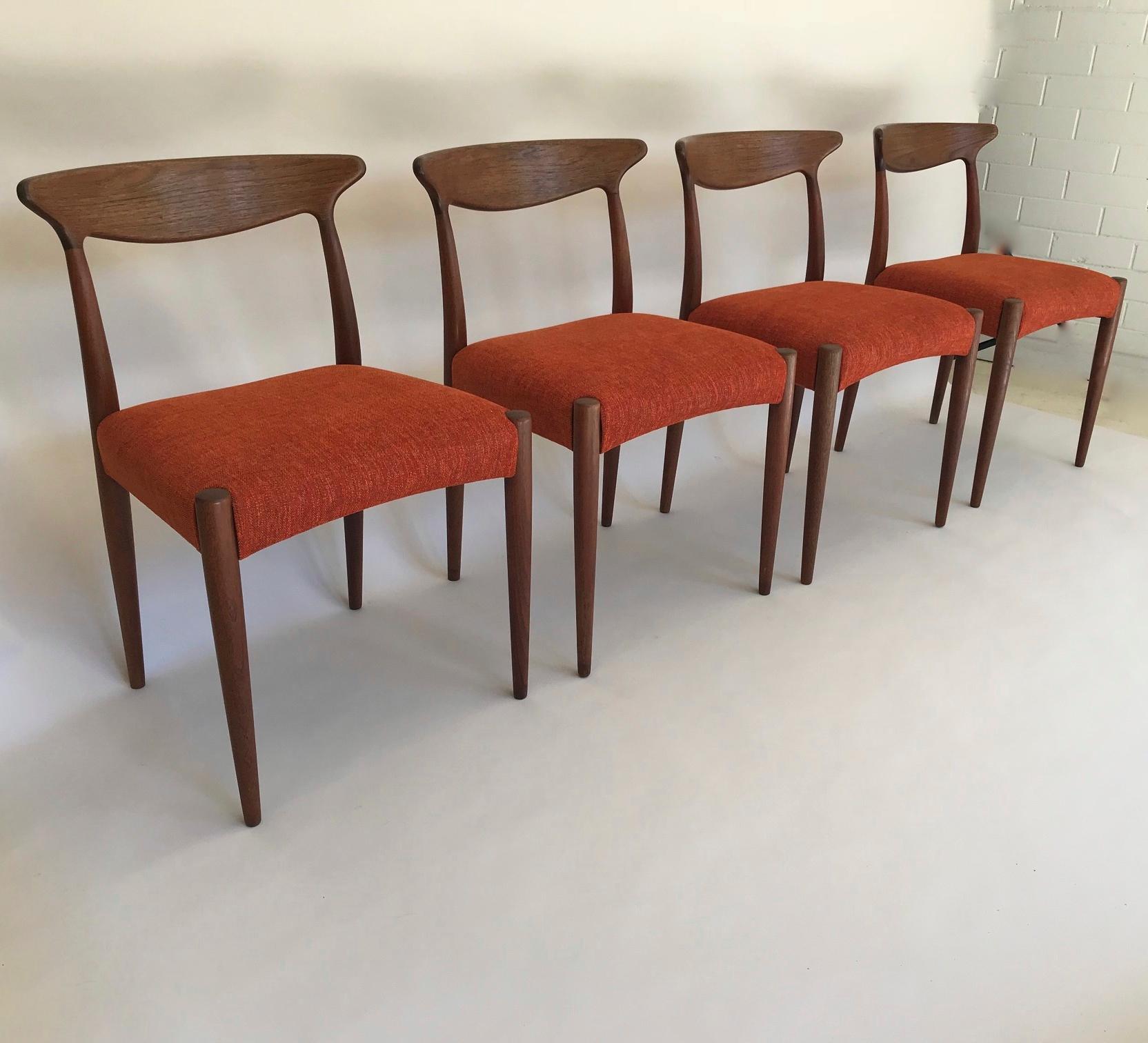 Set of four teak dining chairs designed by Arne Hovmand Olsen. 

Produced by Mogens Kold, Denmark. All chairs are in very good condition, they have been reupholstered in a burnt orange chenille fabric.

Makers plaque on underside of the