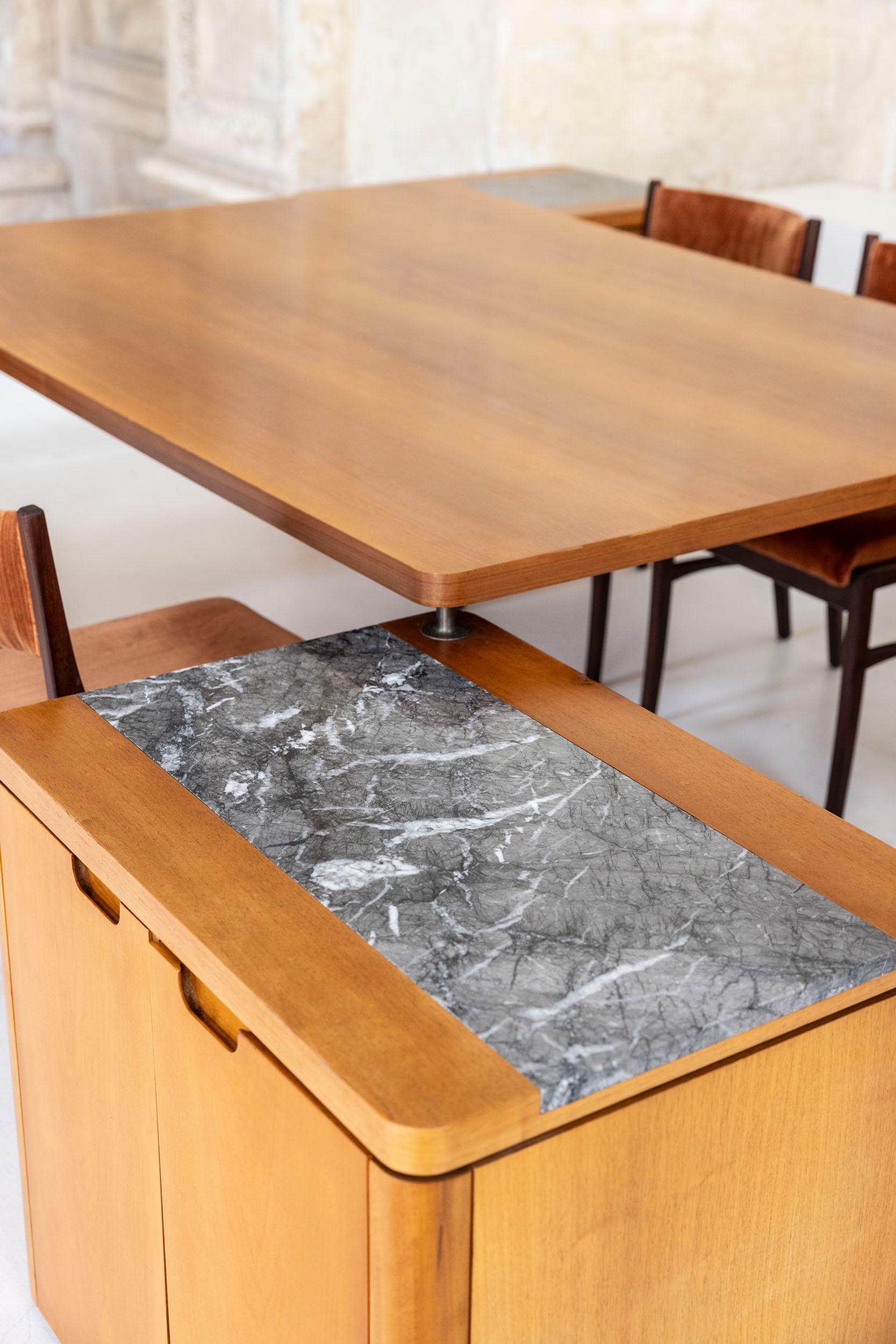 The rare set is designed by Angelo Mangiarotti for Arredamenti Sabatini Genova in 1967.

The set consists of 5 items :
table cm 180x122
2 cabinets cm 72x52 h 65 (shelves)
2 cabinets cm 53x45 h65 (drawers)

The table top is supported by the cabinets