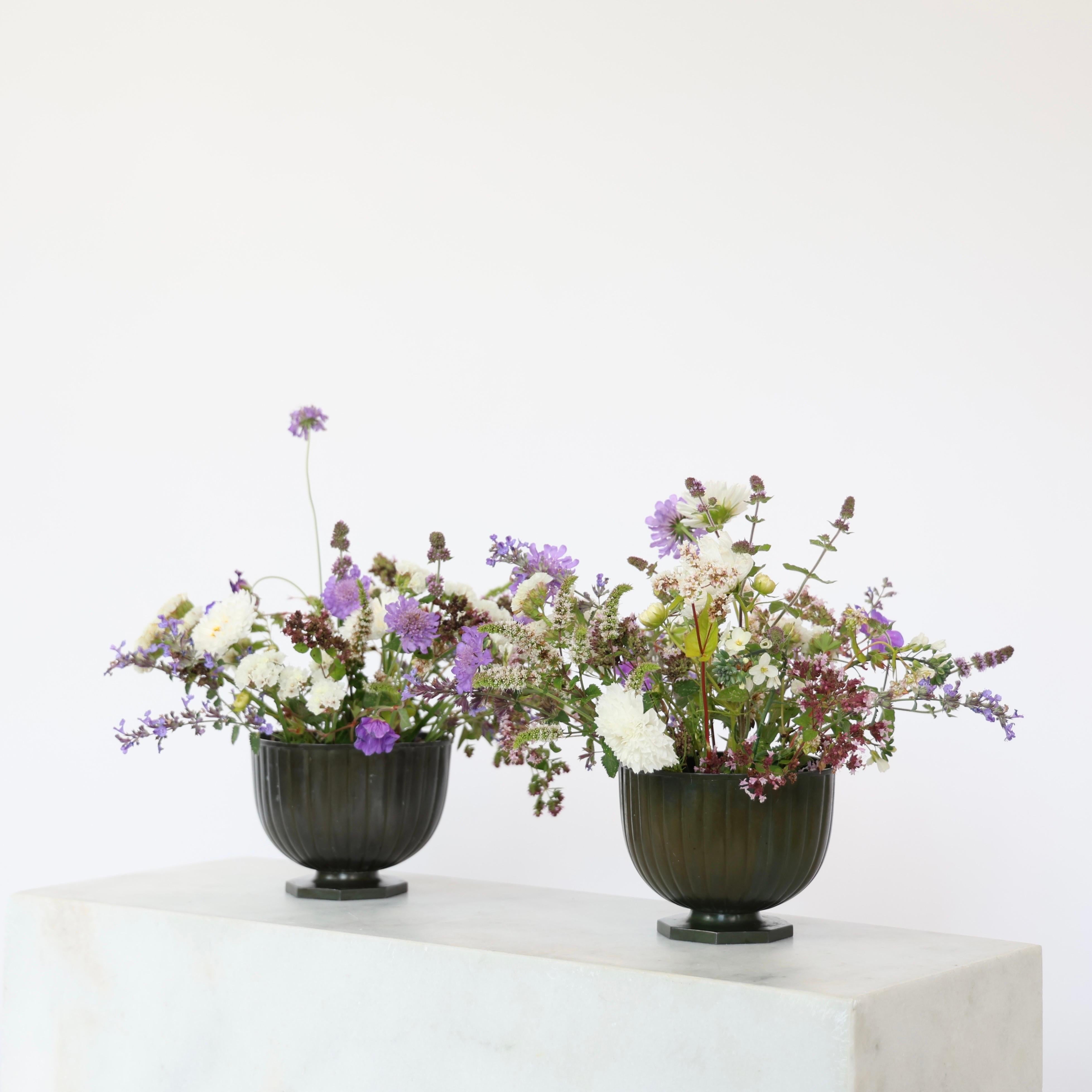 Set of Pedestal Diskometal Planters made by Just Andersen in the 1930s. 

* Square diskometal flowerpots on foot
* Designer: Just Andersen
* Manufacturer: Just Andersen
* Style: D1831
* Year: 1935
* Condition: Good vintage condition. Makers
