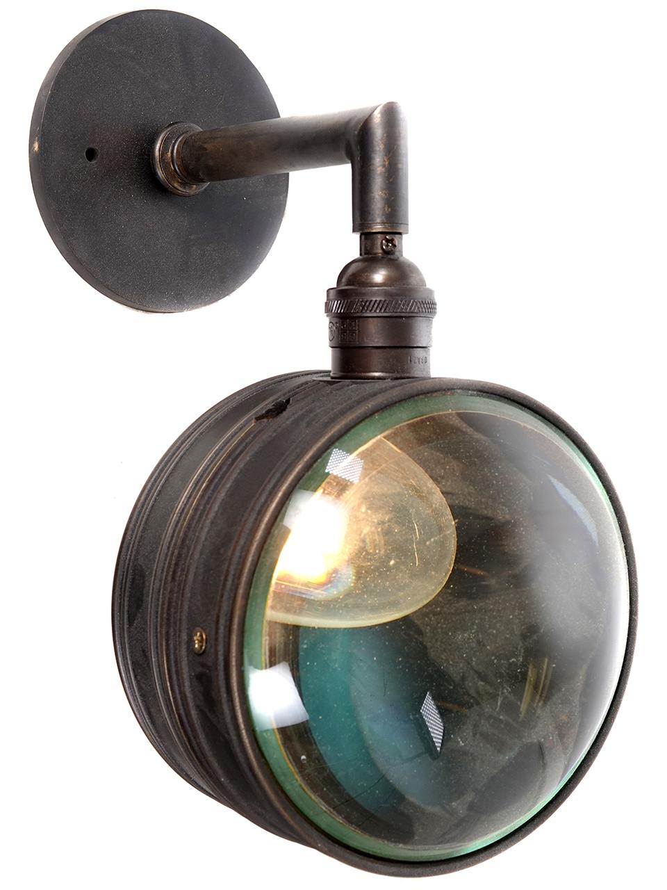 We only made one pair of these sconces. These are the last 2 and there will be no more. The shade is a drum shape with one side flat frosted glass and the other a domed magnifying glass. The shade can be installed with the glass facing left and