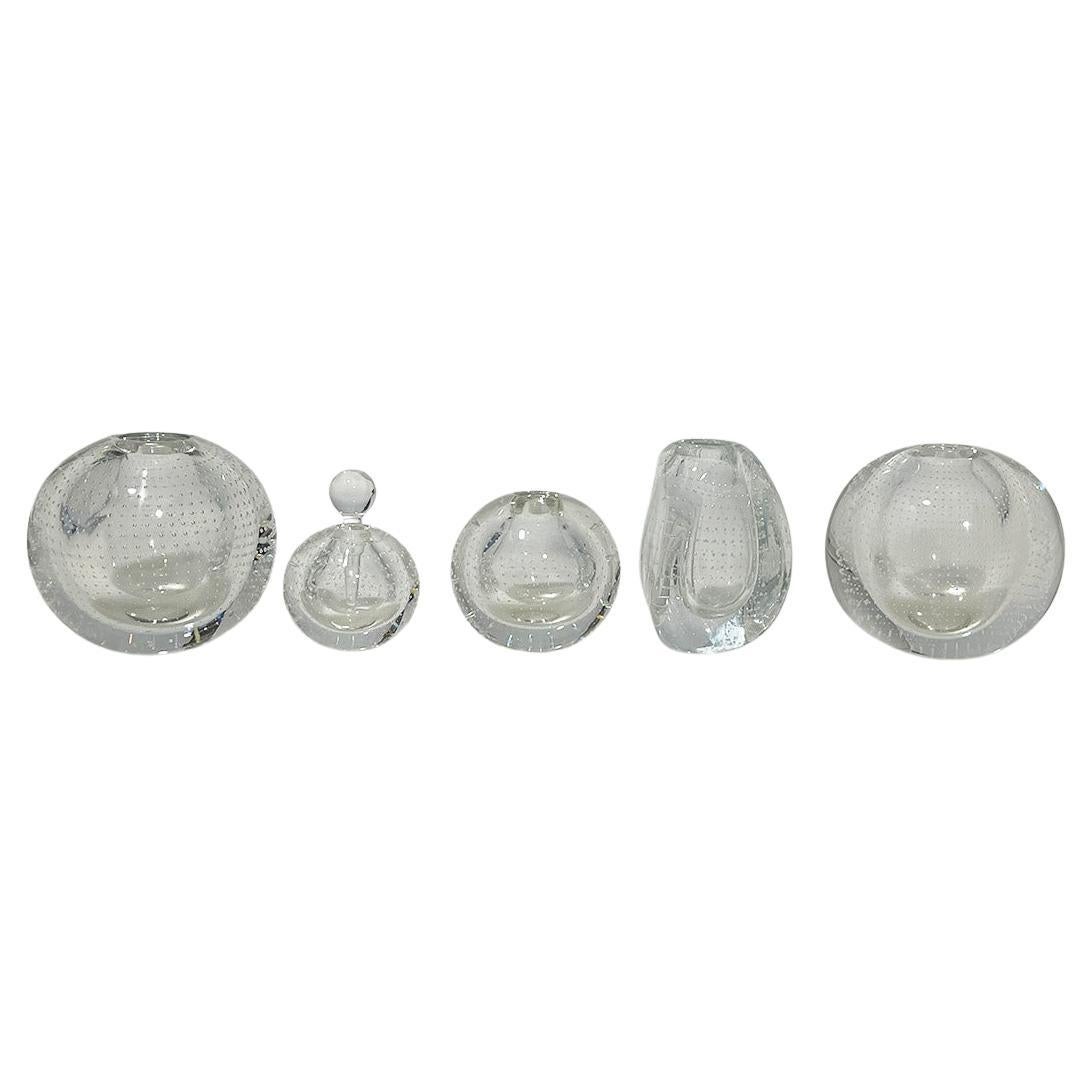 Set of Dutch glass vases by A.D. Copier for Leerdam, Mid-20th Century

A Dutch set of four glass vases and a perfume bottle by Andries Dirk Copier for Leerdam. Three clear glass nail balls 