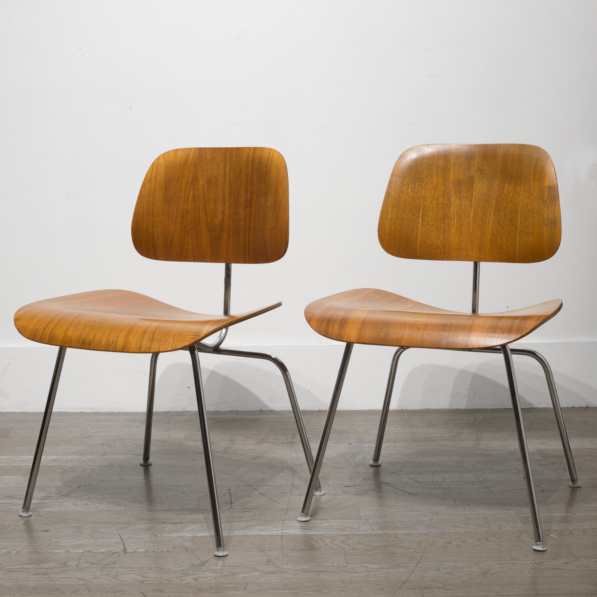 About

This is a set of early Herman Miller DCM (dining chair metal) with walnut veneer seat and back with metal legs. These chairs are fabricated from molded plywood seats and backs attached to a metal base, creating a minimal silhouette. The grain