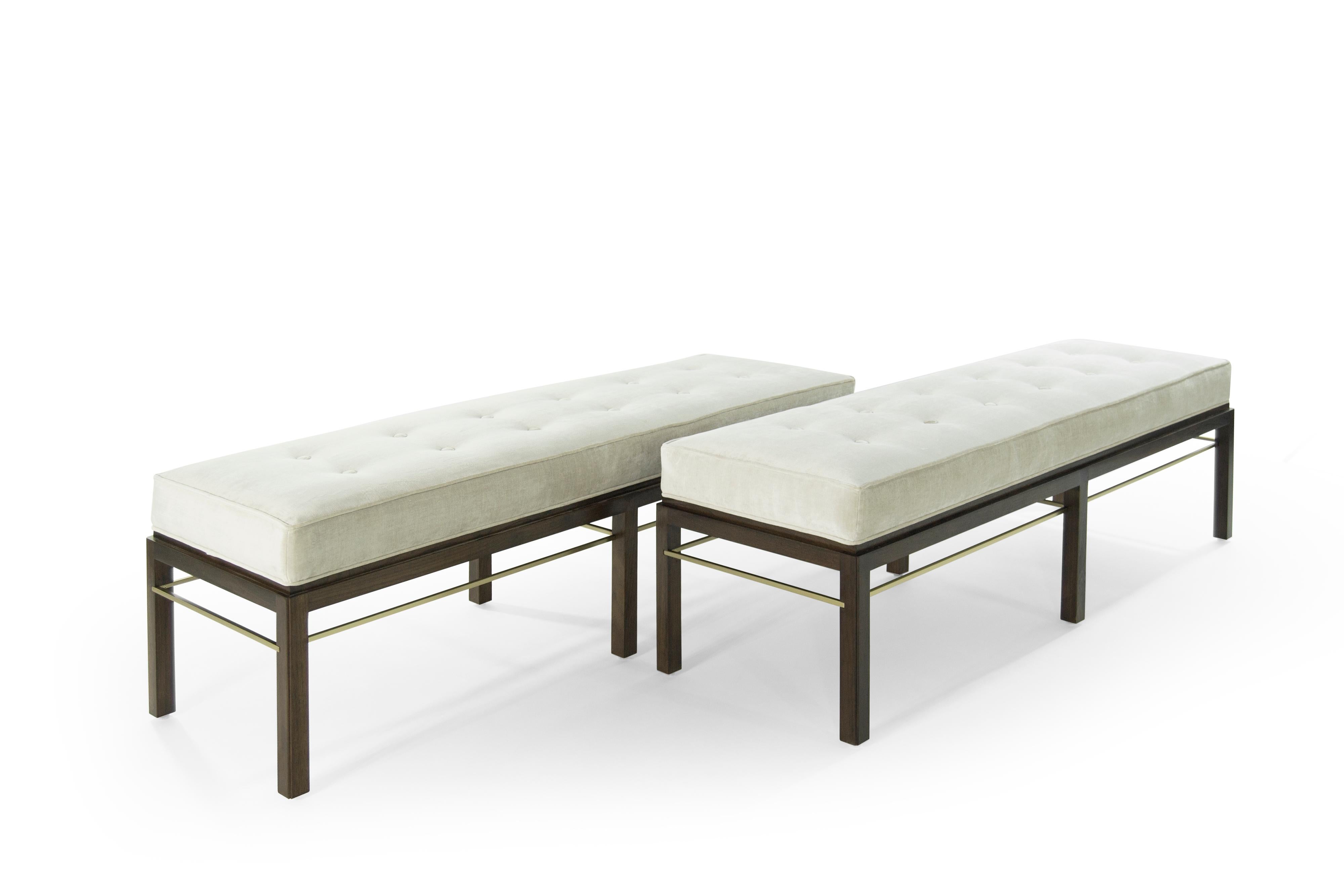 Stunning and rare pair of benches newly upholstered in off-white chenille, designed by Edward Wormley for Dunbar.

Walnut fully restored. Brass stretchers newly polished. Priced as a pair.