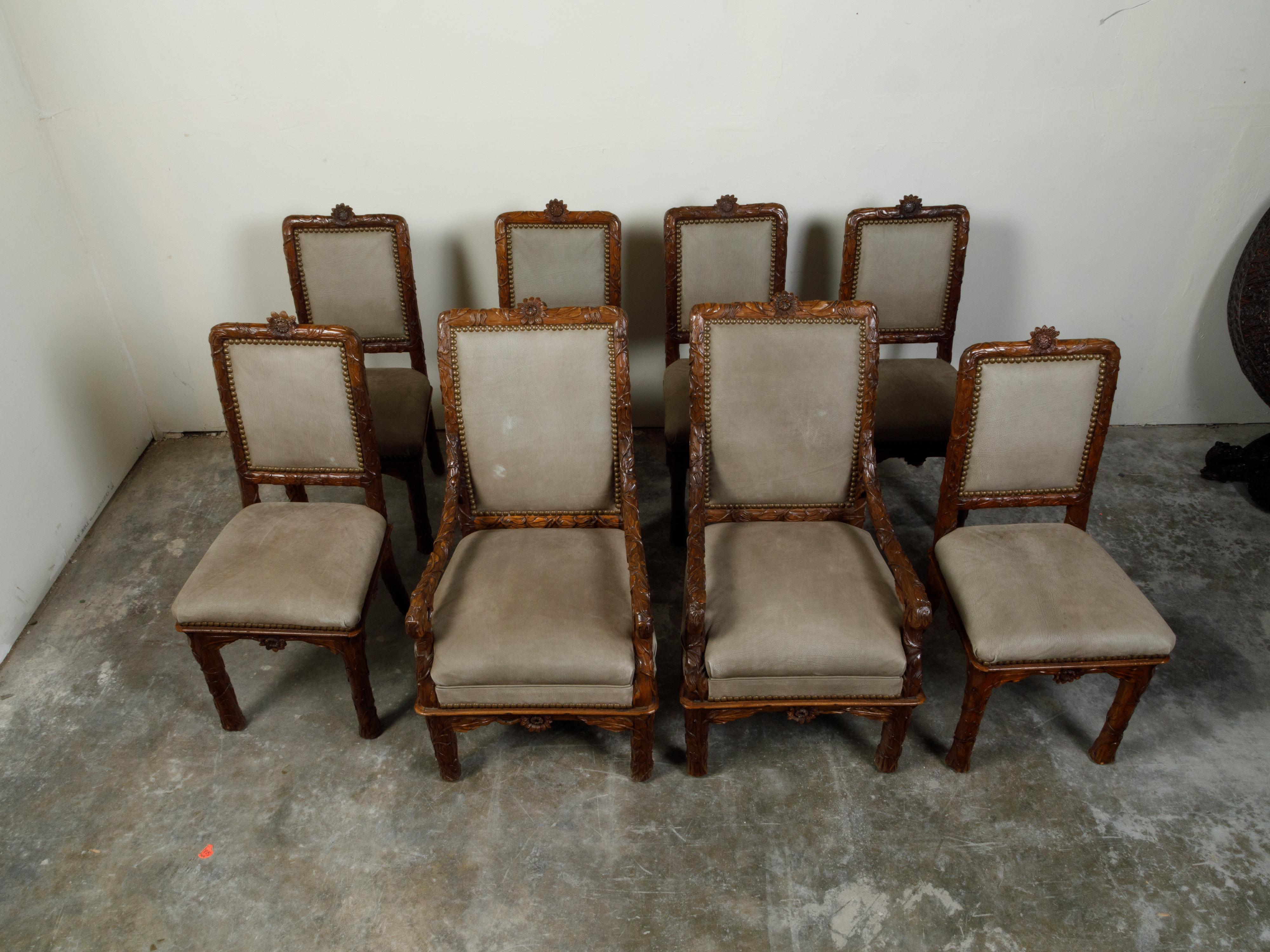 Swiss Set of Eight 1920s Black Forest Dining Room Chairs with Hand-Carved Floral Décor For Sale