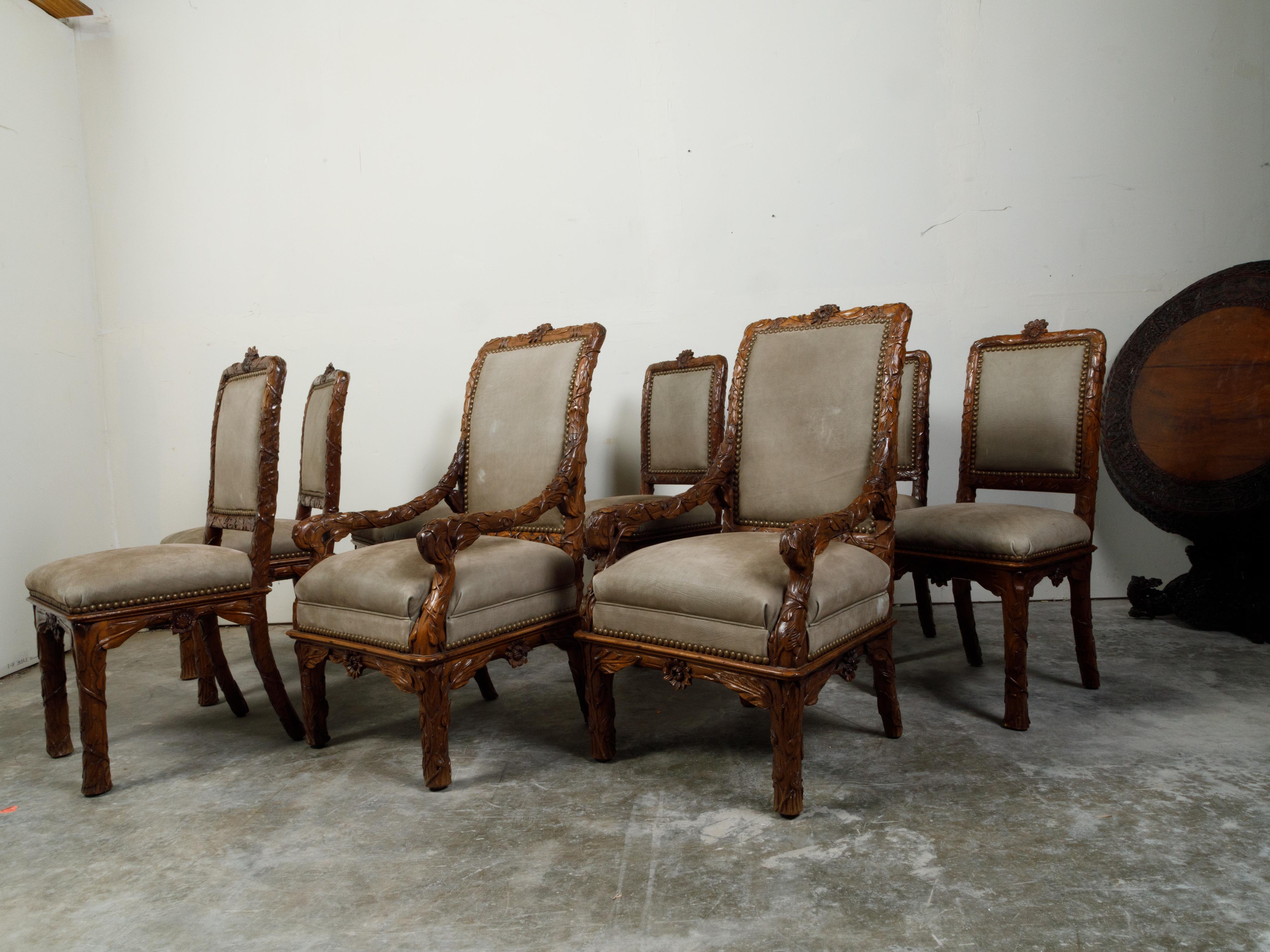 20th Century Set of Eight 1920s Black Forest Dining Room Chairs with Hand-Carved Floral Décor For Sale