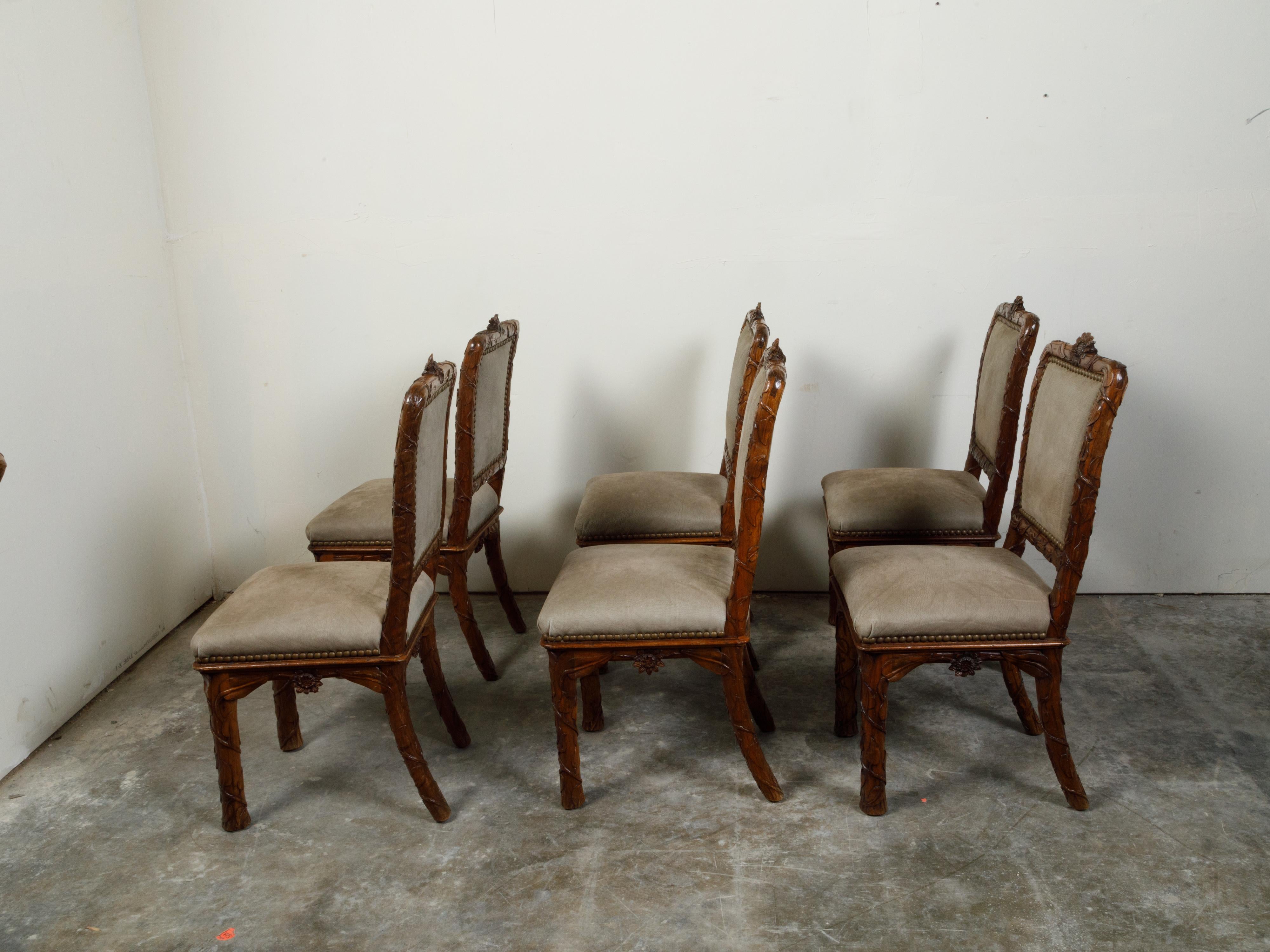 Upholstery Set of Eight 1920s Black Forest Dining Room Chairs with Hand-Carved Floral Décor For Sale