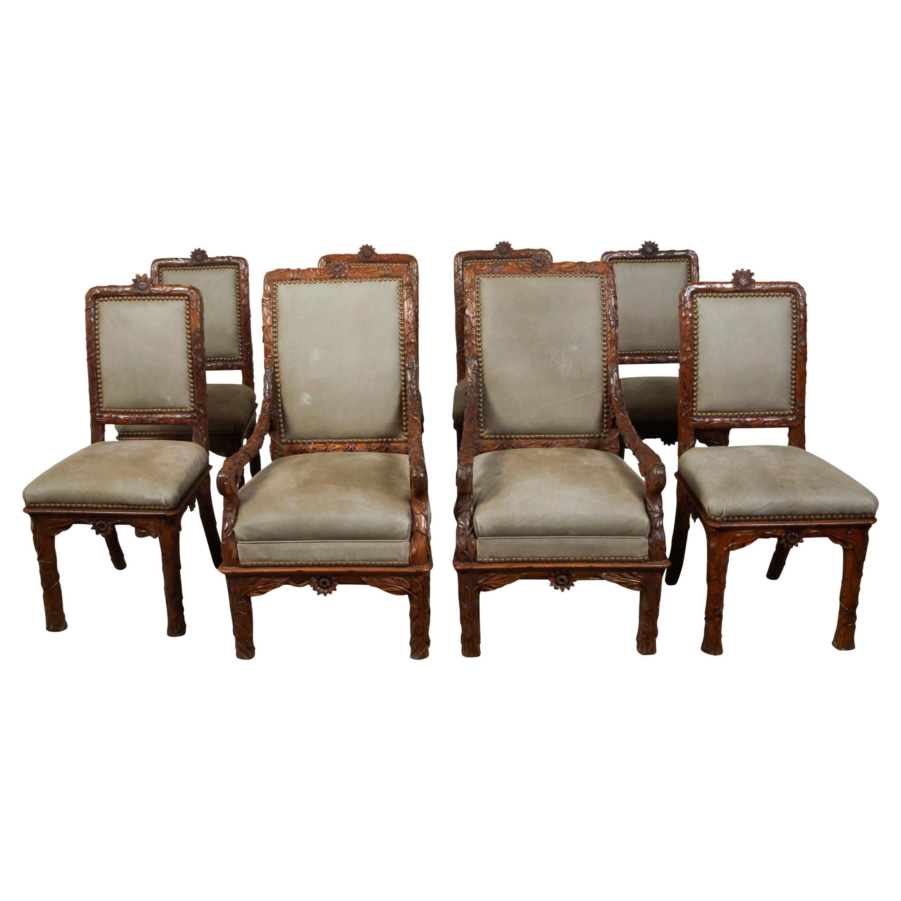Set of Eight 1920s Black Forest Dining Room Chairs with Hand-Carved Floral Décor For Sale