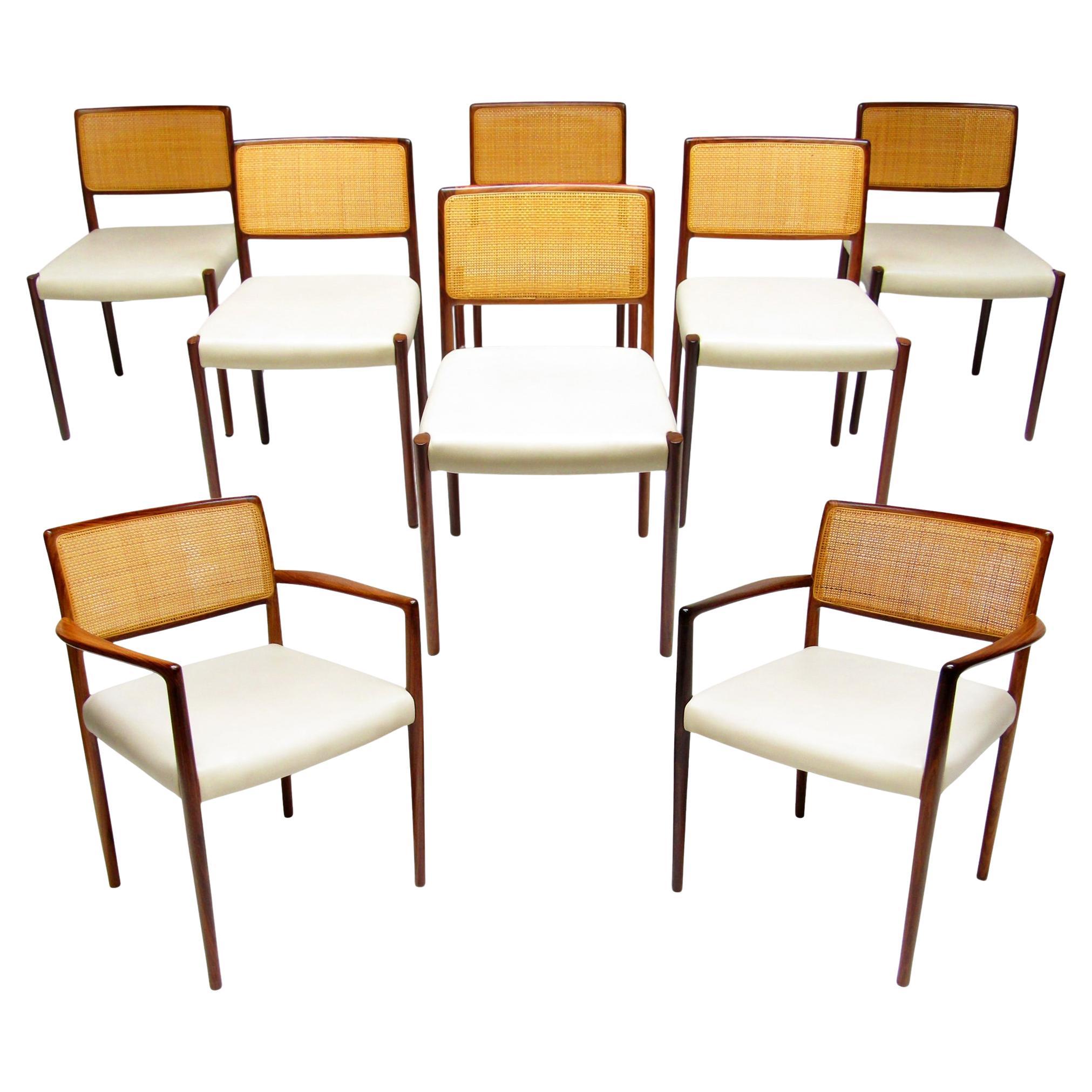 Set Of Eight 1960s Danish Dining Chairs In Rosewood & Rattan By Niels Moller For Sale