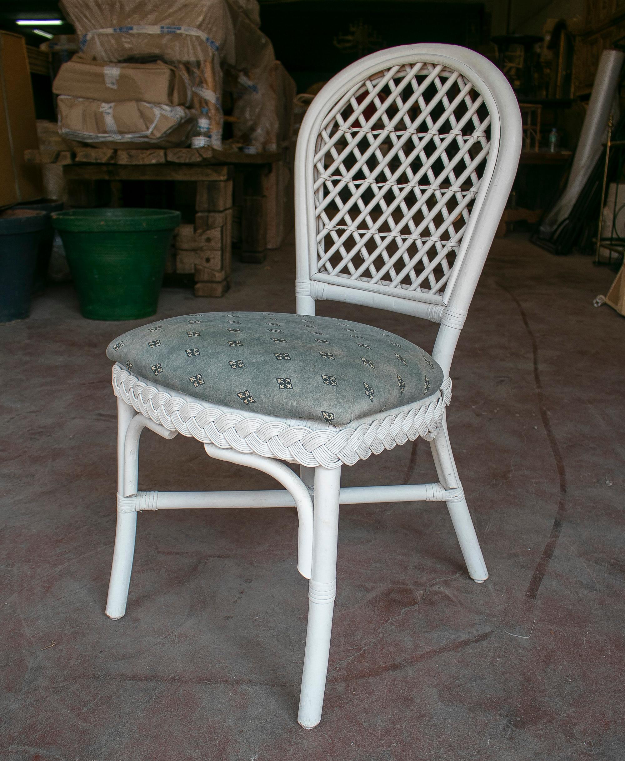Set of eight vintage 1980s Spanish woven wicker white chairs.