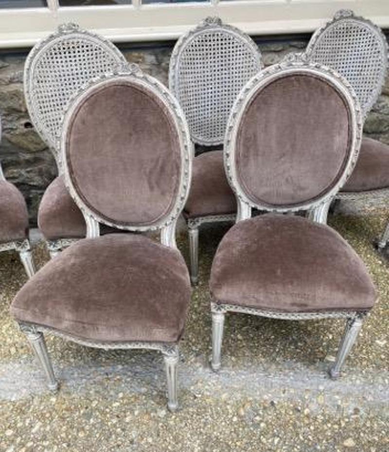 Set of Eight 19th century French cane back dining chairs with gray velvet seats. New performance velvet seats. Head chairs also have velvet on the back, the remaining six chairs have cane backs. France, 1801-1900.
Each seat measures 39