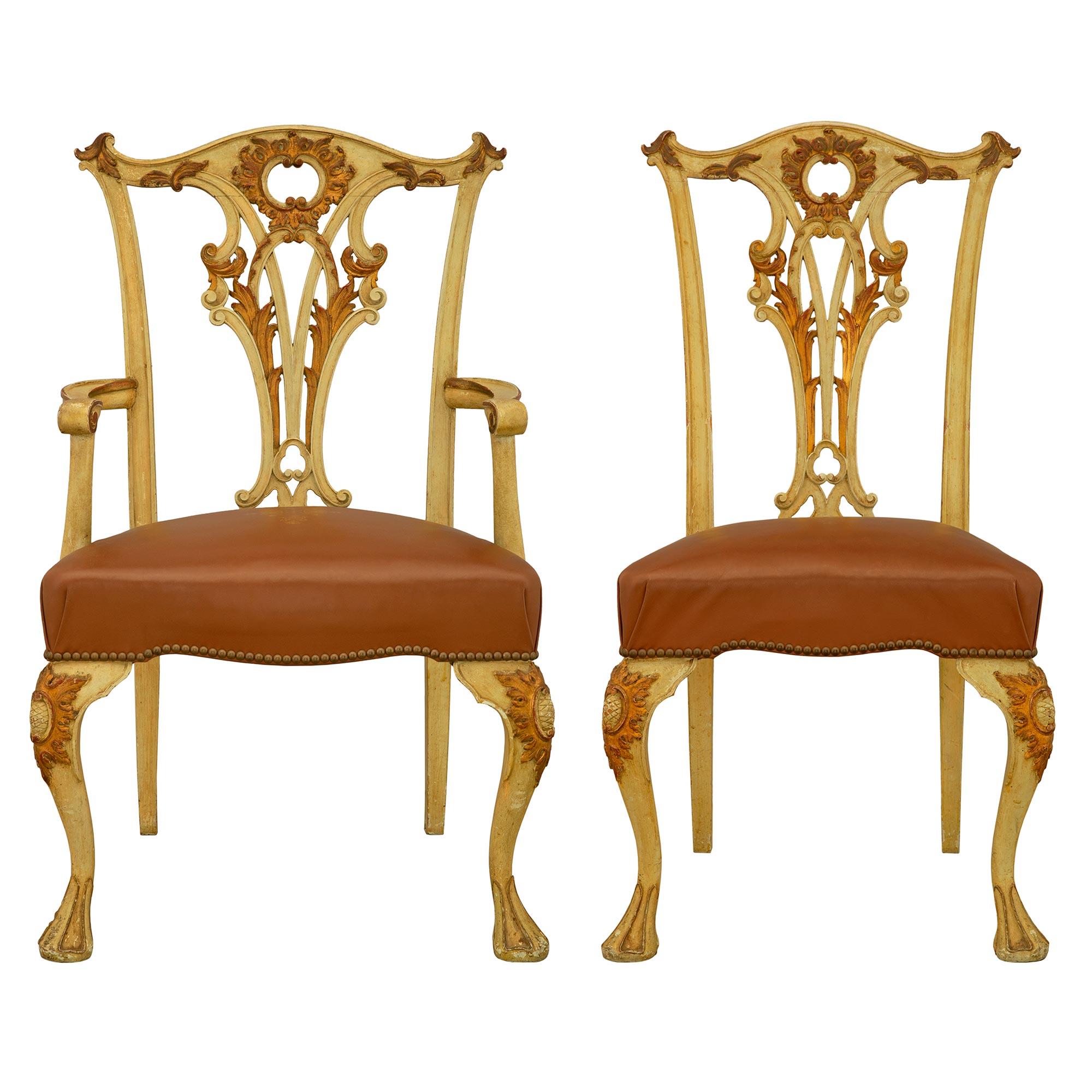 A very attractive late 19th century Italian complete set of six side and two armchairs. The Chippendale st cream color patinated and gilt chairs are richly carved on the cabriole legs and the pierced back with scrolls and acanthus leaves. The