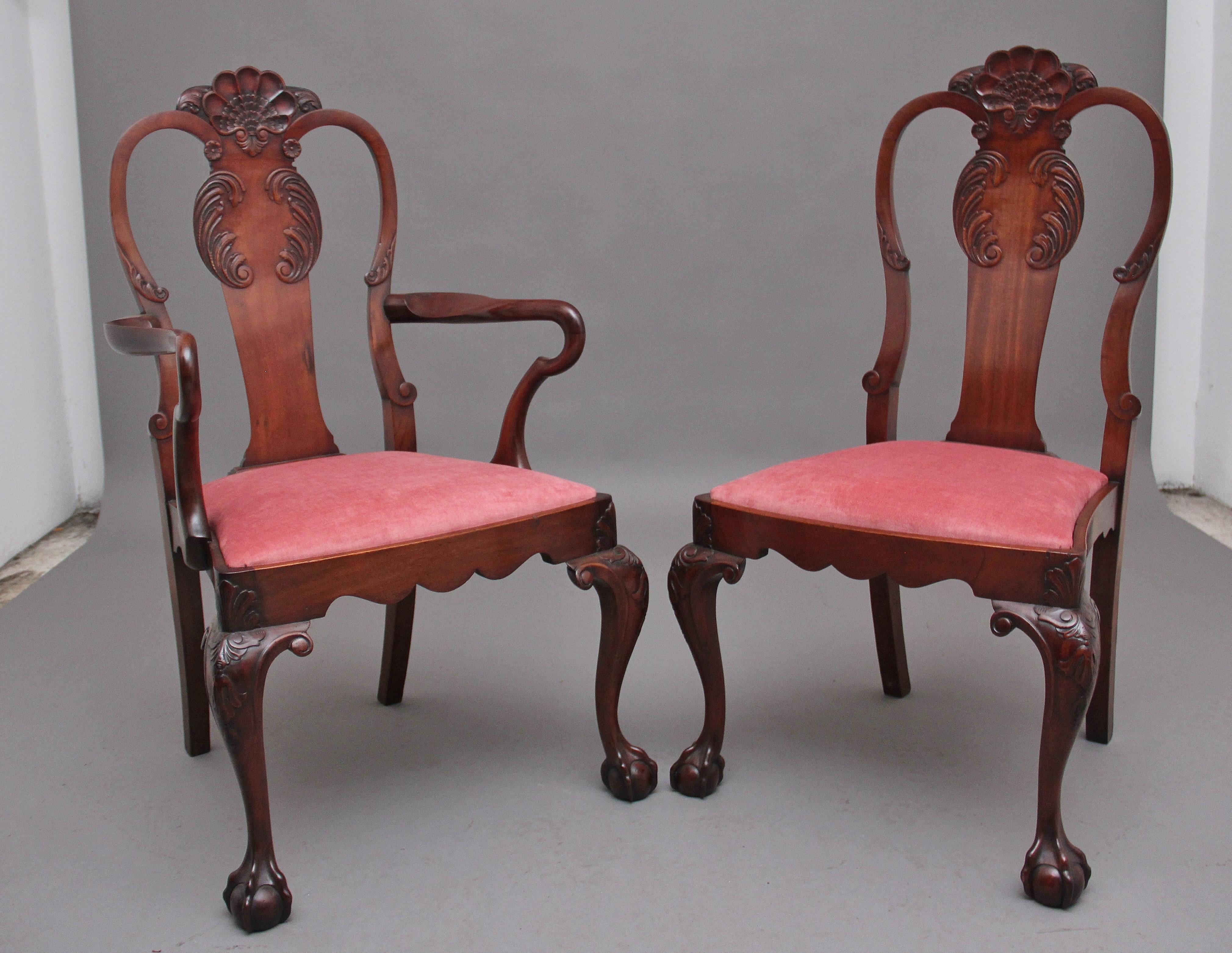 A set of eight mahogany dining chairs in the Queen Anne style, consisting of six side chairs and two armchairs, the shaped central splat back with carved shell decoration flanked by curved uprights, the elegant shaped arm supports leading down to