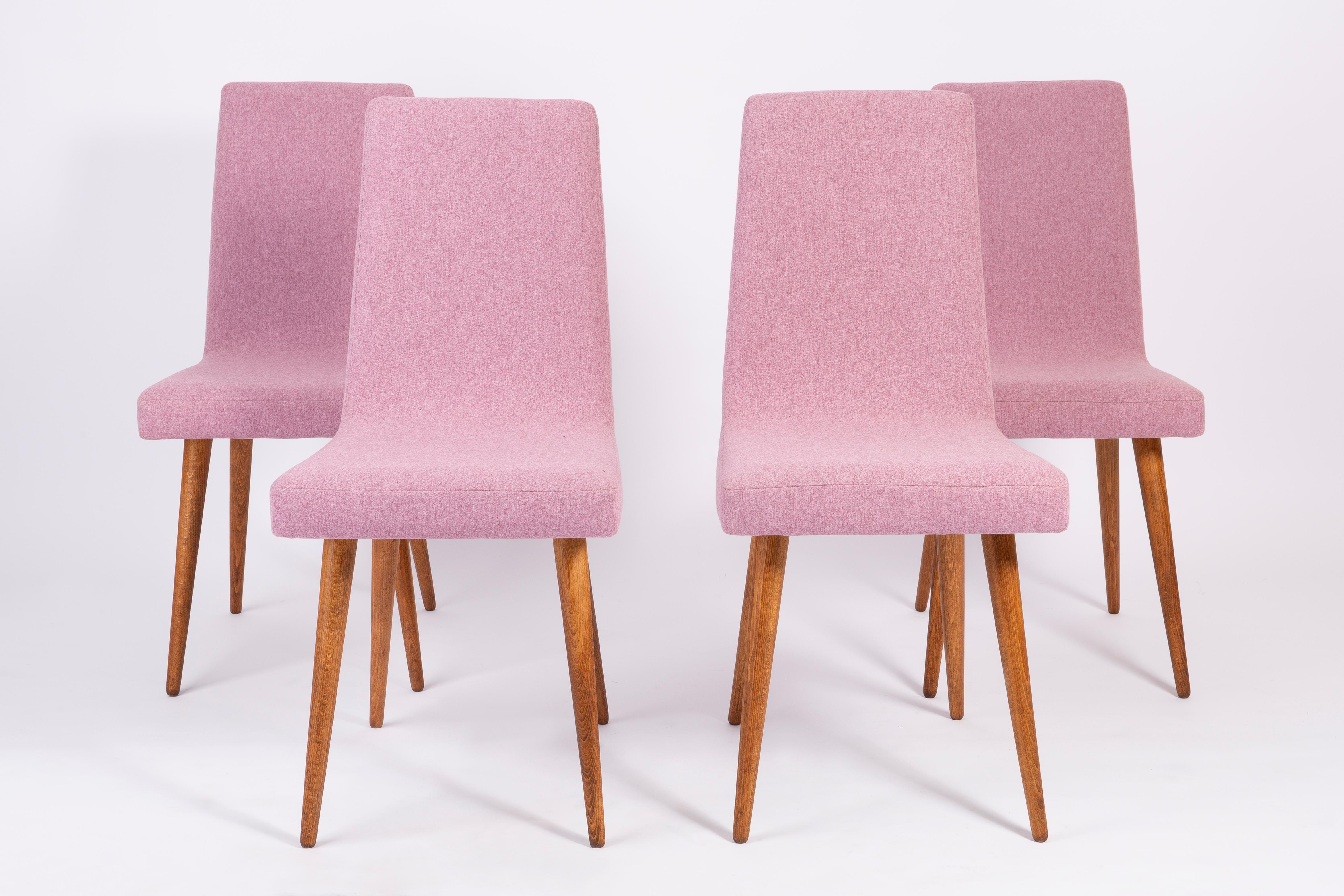 Chairs designed by Prof. Rajmund Halas. They have been made of beechwood. They have undergone a complete upholstery renovation, the woodwork has been cleaned and refreshed. We used matte varnish. Seats and backs were dressed in a pink mélange (color