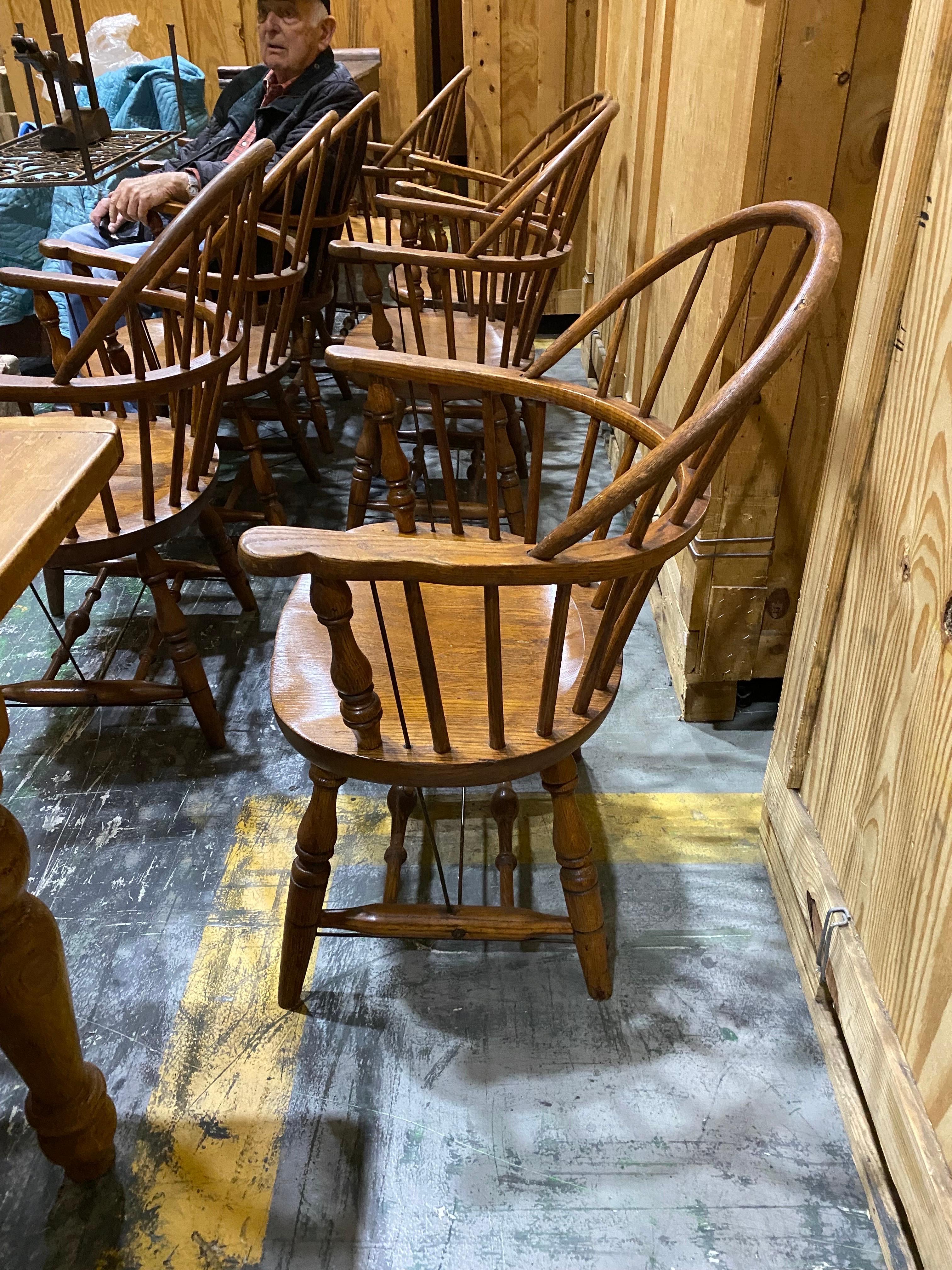 Set of Eight 20th Century Windsor armchairs by Nichols & Stone
A handsome group of eight American Windsor Chairs made by one of the oldest furniture companies in the United States. Solid oak, some chairs with reinforcement rods. Some general wear