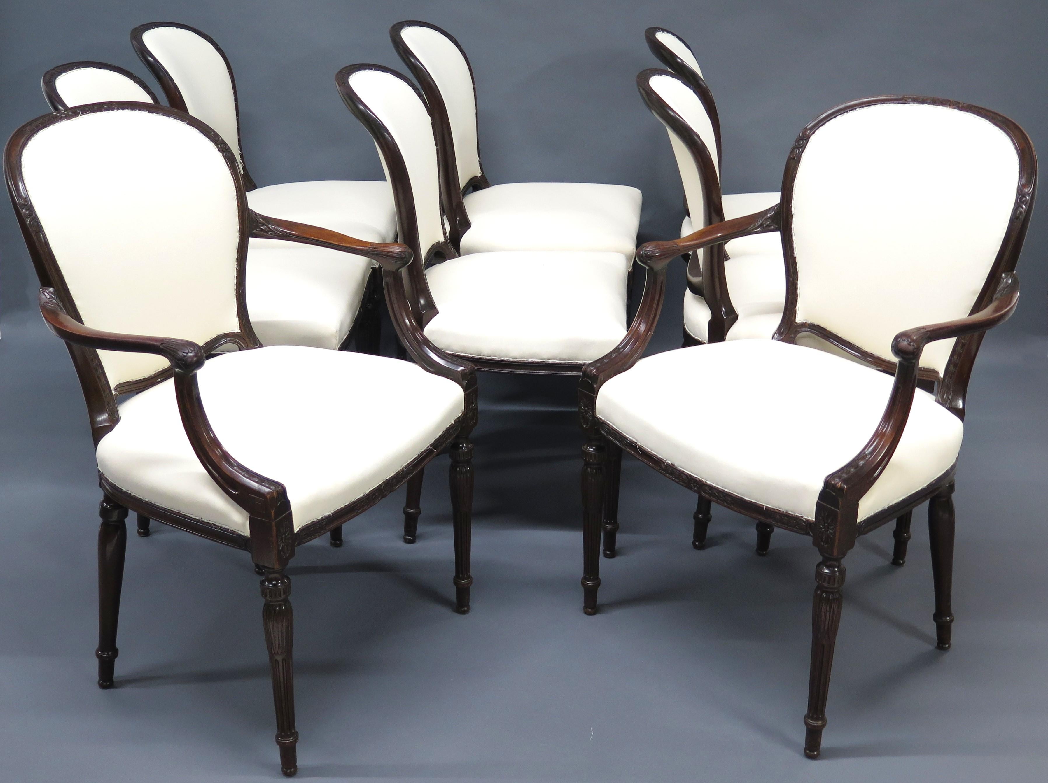 a set of eight (8) George III mahogany dining chairs, 6 side chairs and 2 elbow chairs, upholstered in muslin, ready for show cloth, turned reeded legs. England. circa 1800

MEASUREMENTS:

34.75