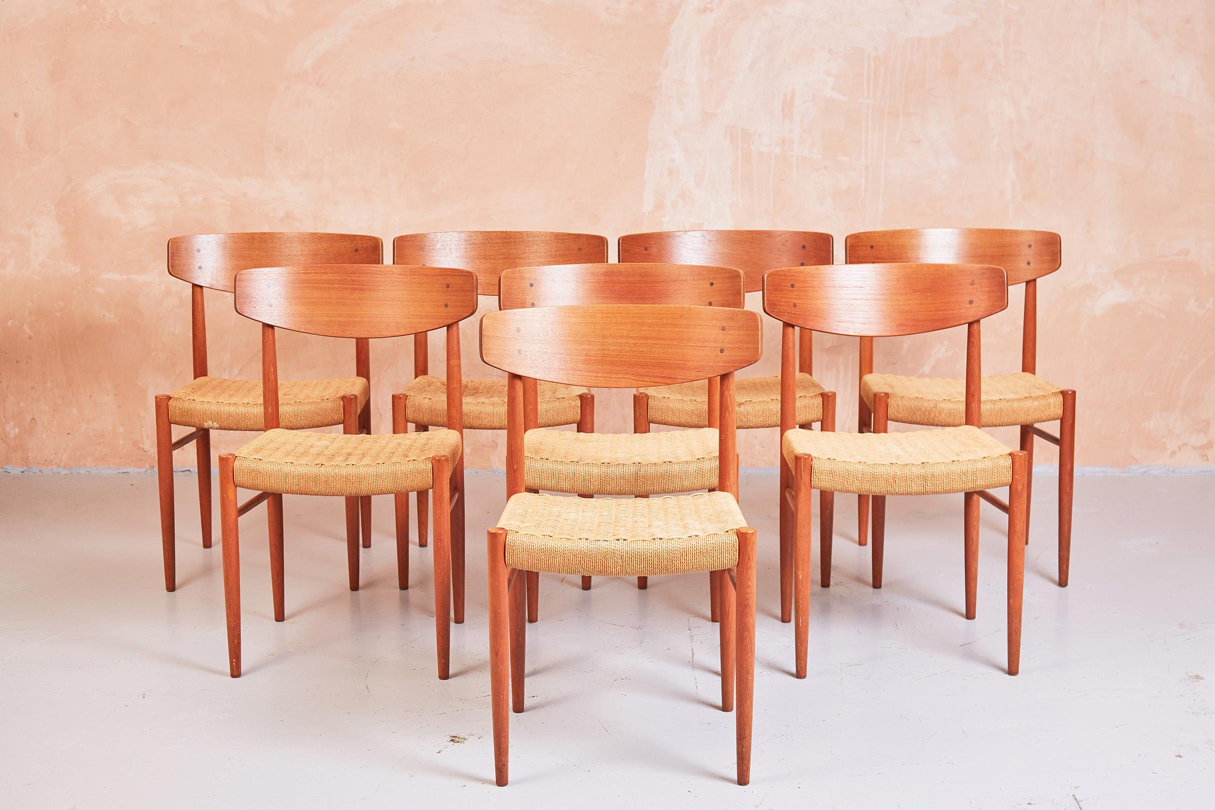 Stunning set of eight, model 501, dining chairs by Danish manufacturer A.M. Mobler. 
Produced in the 1960s. 
Made from teak with spade backrests and woven paper cord seats.
 