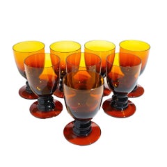 Set of eight amber glass pedestal rummers, 1950's