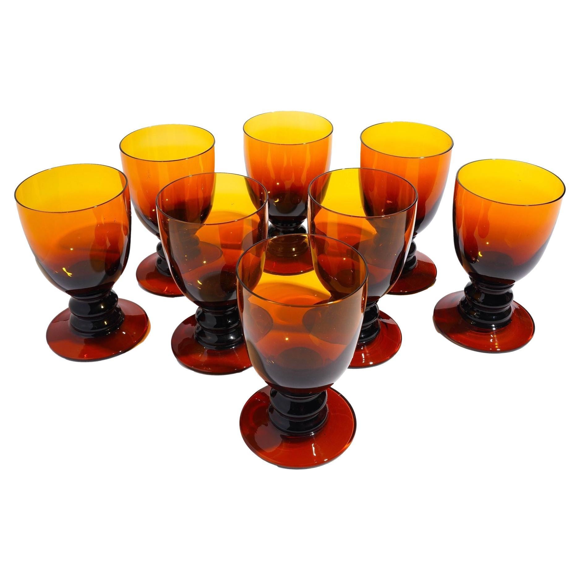 Set of eight amber glass pedestal rummers, 1950
s