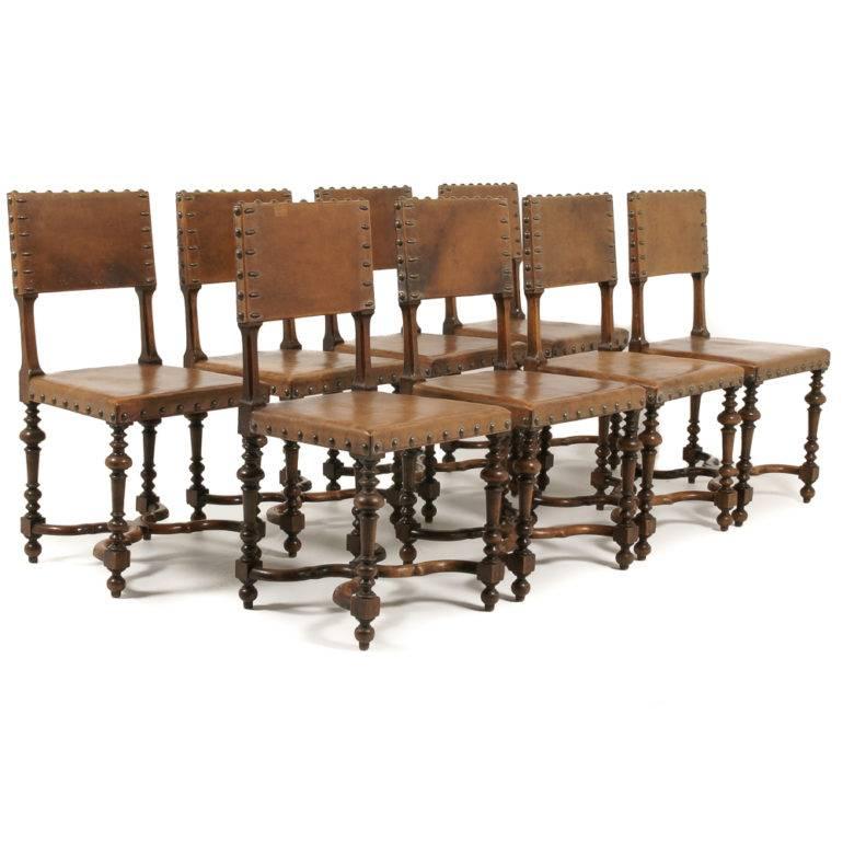 A beautiful set of eight walnut-framed dining chairs with leather backs and seats. Sturdy and suitable for everyday use. Nicely turned legs and support struts, and large patinated brass studs to edges of the leather, circa 1880.



       