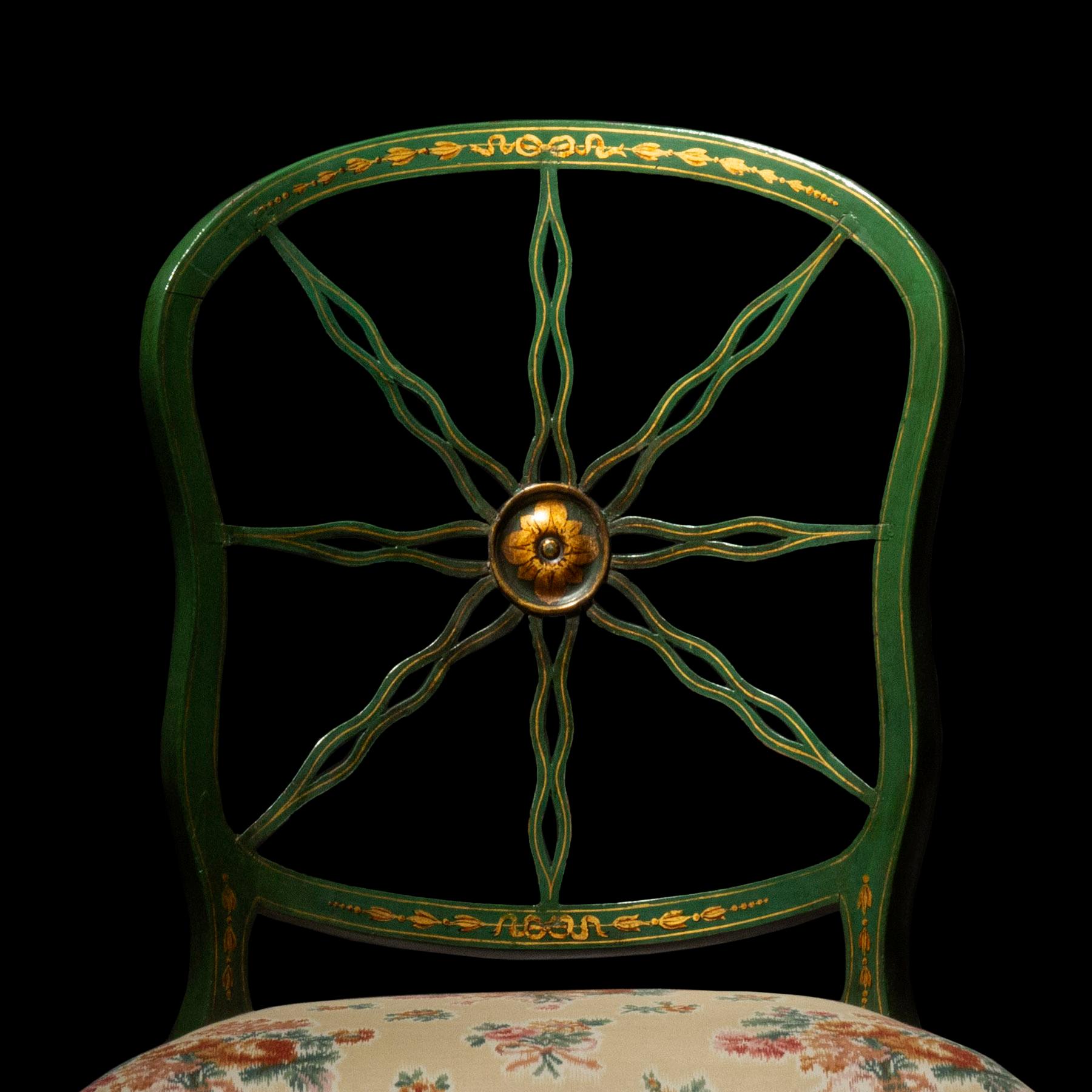 A wonderfully decorative set of six green painted and intricately decorated 'ribbon-back' chairs. A pair of identical chairs (of a slightly later date) available in a separate listing.
English, circa 1790's

Why we like them
Their delicate and