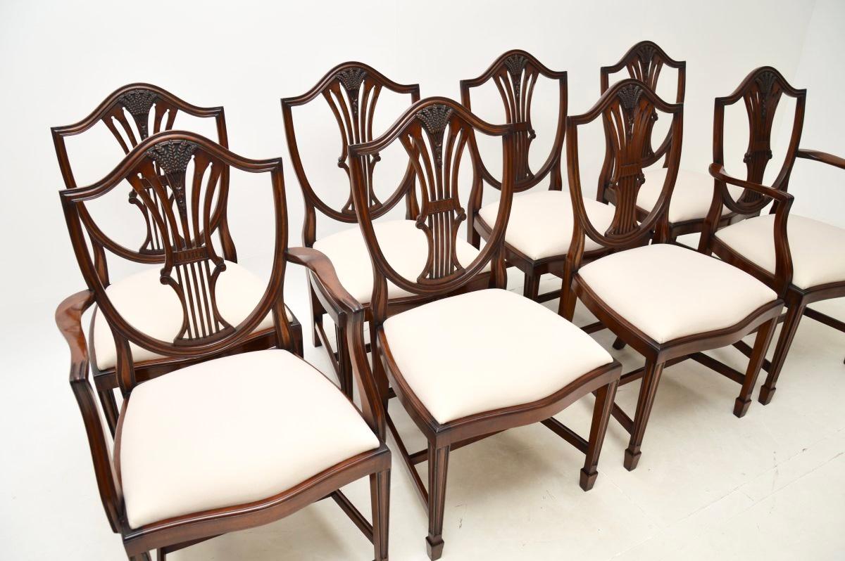 A lovely set of eight antique shield back dining chairs in the Sheraton style. They were made in England, and date from around the 1930’s.

The quality is superb, they have beautifully carved pierced back rests with wheat sheaf motifs. They have
