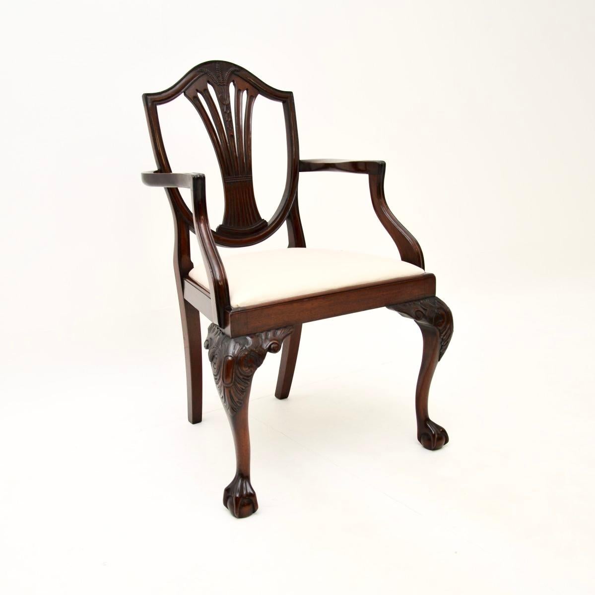 A fantastic set of eight antique shield back dining chairs. They were made in England, they date from around the 1900-1910 period.

The quality is outstanding and the wood has acquired a gorgeous patina over the years. They have pierced shield back
