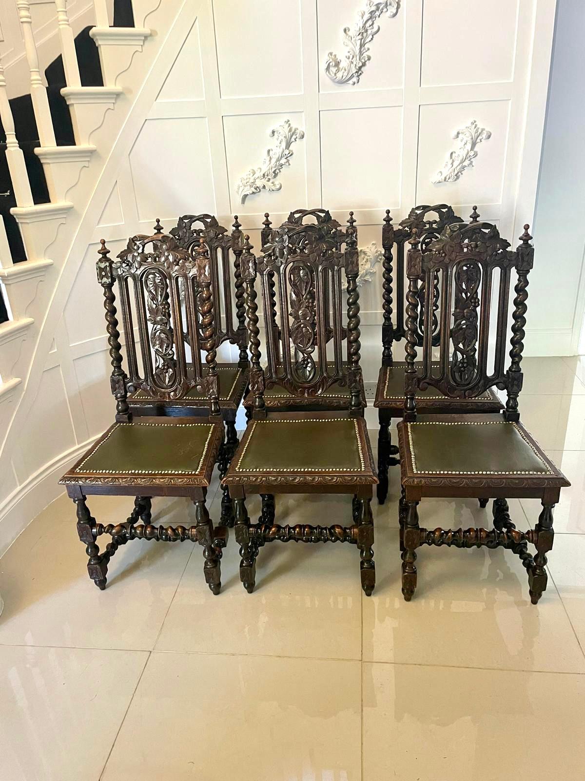 Set of eight antique Victorian quality carved oak dining chairs consisting of two armchairs and six single chairs having quality high carved backs depicting grapes, leaves, scrolls and barley twist supports. The arm chairs having carved open arms