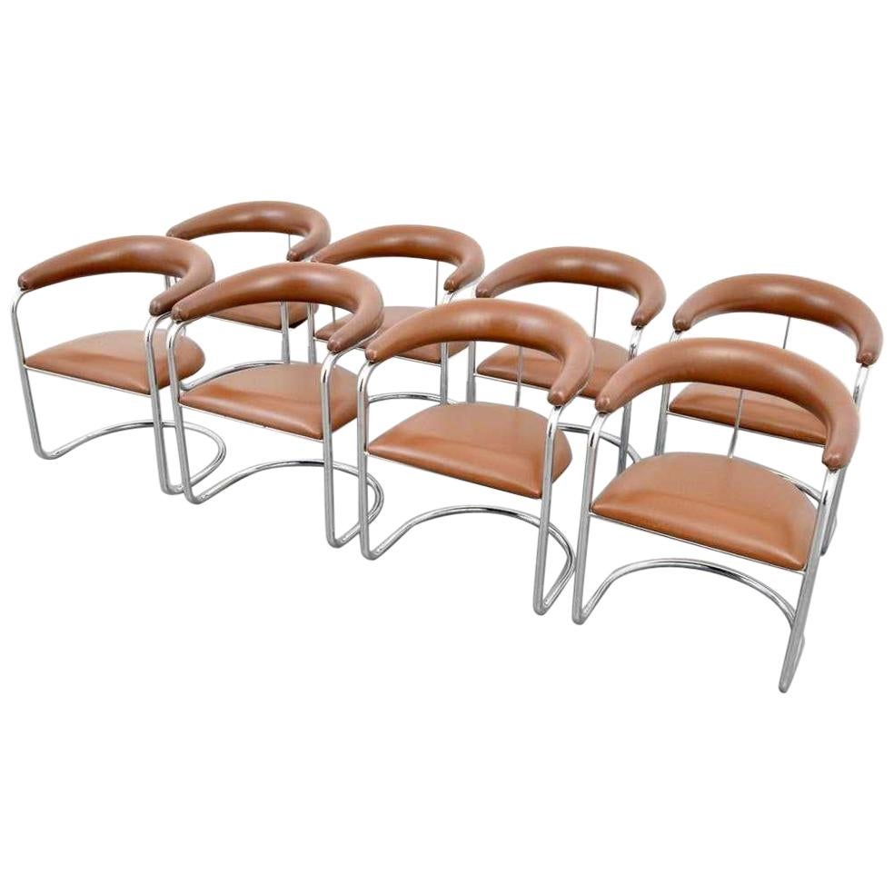 Set of eight armchairs designed by Anton Lorenz for Thonet. Each chair has tan upholstered backrest and seat with polished chrome tubular frames.

Mid-Century Modern S-37 chairs were originally designed by Anton Lorenz in 1929 and later