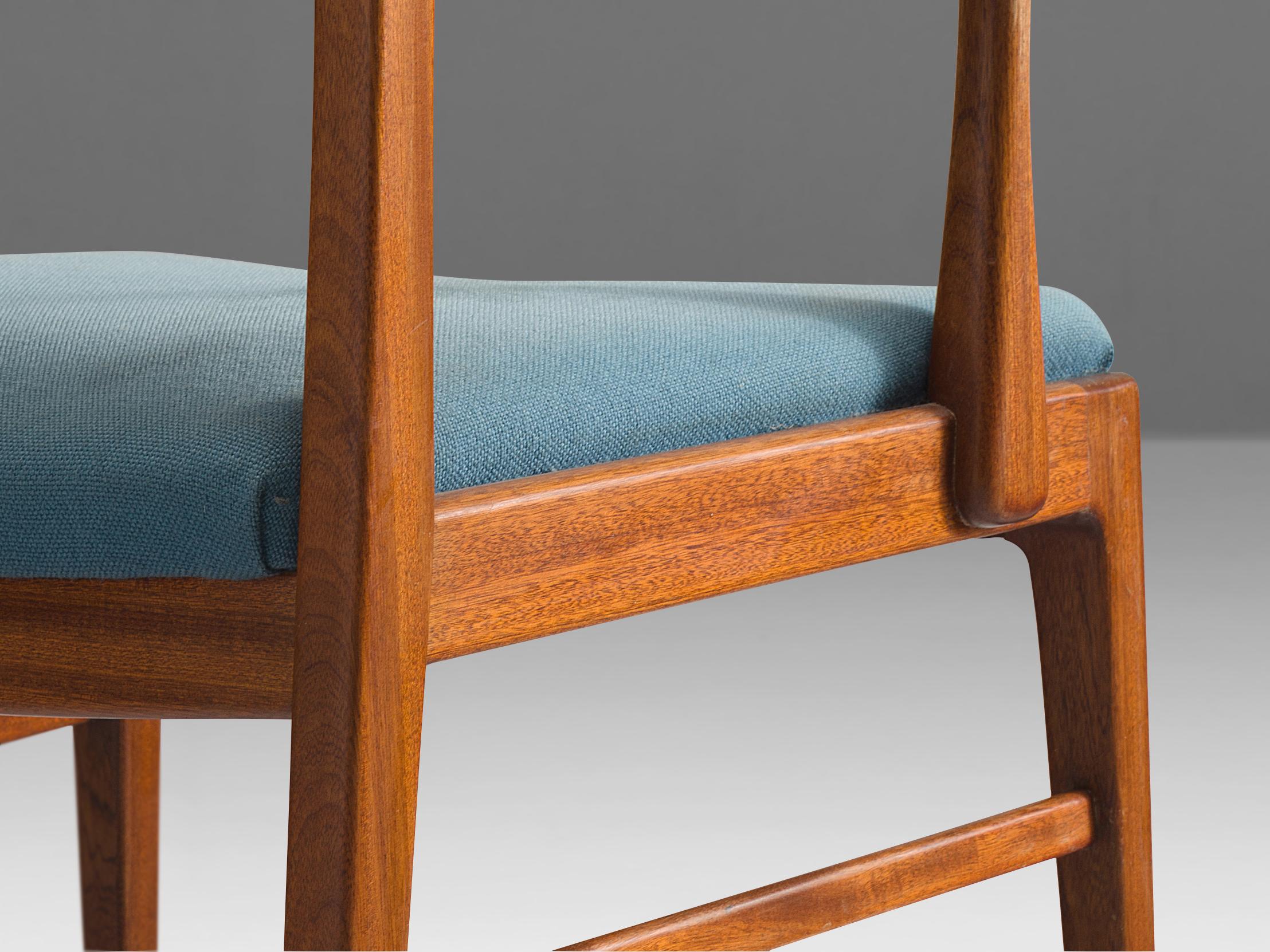 Set of eight armchairs, mahogany, upholstery, Denmark, 1960s

Set of eight sculpted dining chairs in solid oak and blue upholstery. These chairs show the characteristics of the well-crafted furniture. Wood joints are shown at the armrests and