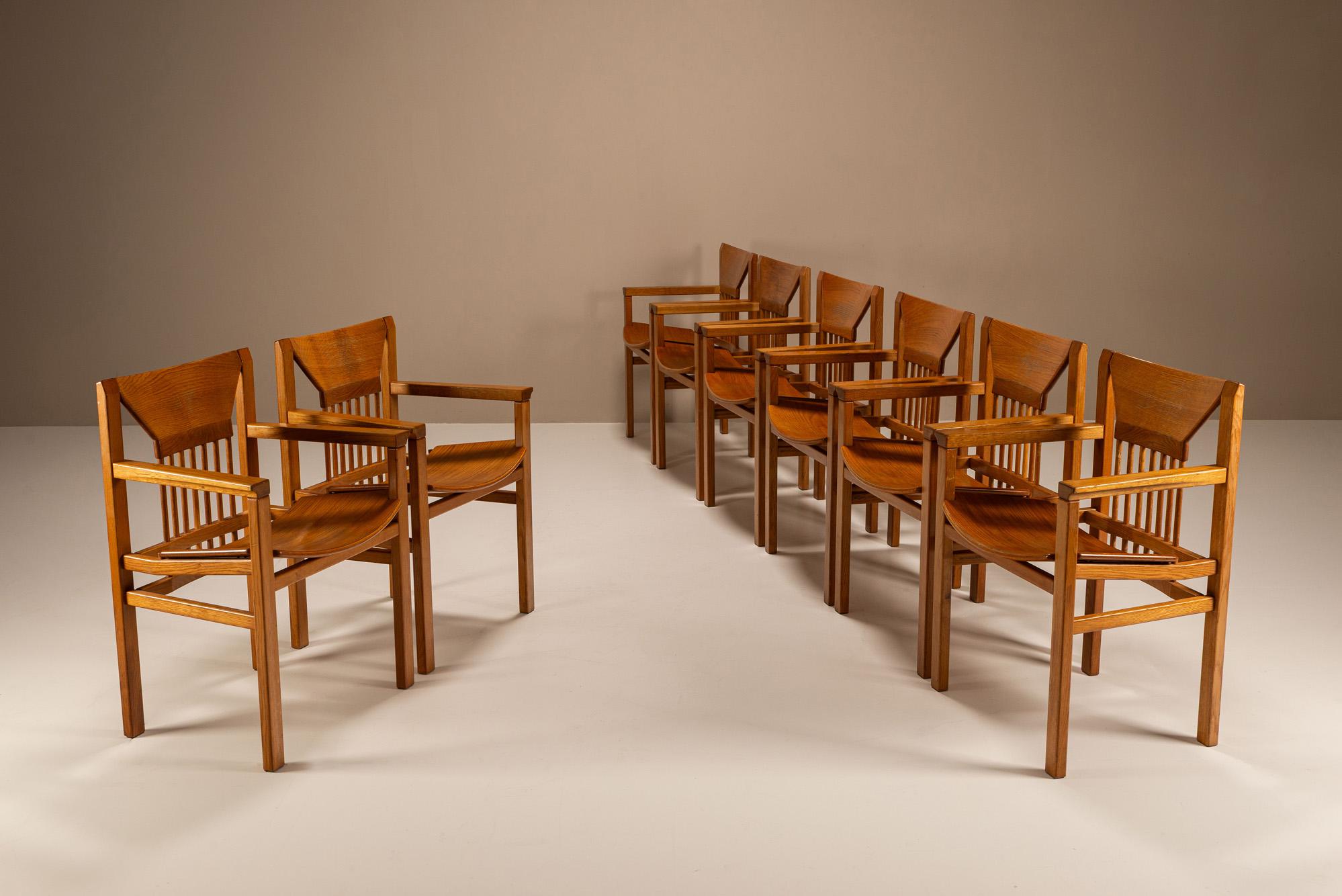 A sculptural rhythm defines this rare set of eight armchairs by Italian designer Giuseppe Rivadossi. Known for his architectural approach to furniture, Rivadossi combined craftsmanship with a reverence for material, resulting in designs that feel