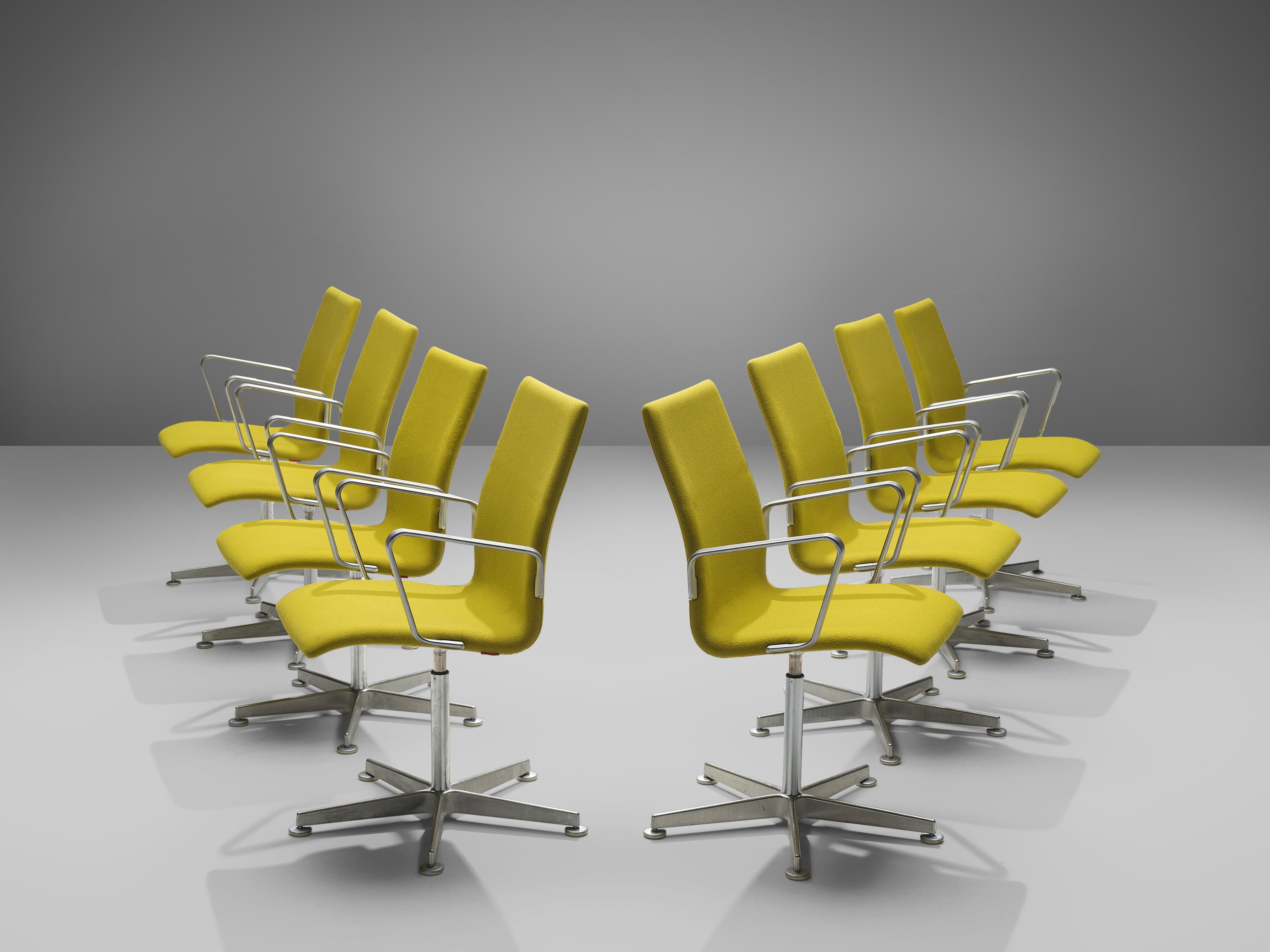Arne Jacobsen for Fritz Hansen, set of eight 'Oxford' chairs, metal, yellow fabric, Denmark, design 1965, later production

These classic executive office chairs feature a medium high back (as opposed to the models with a low and a very high back),