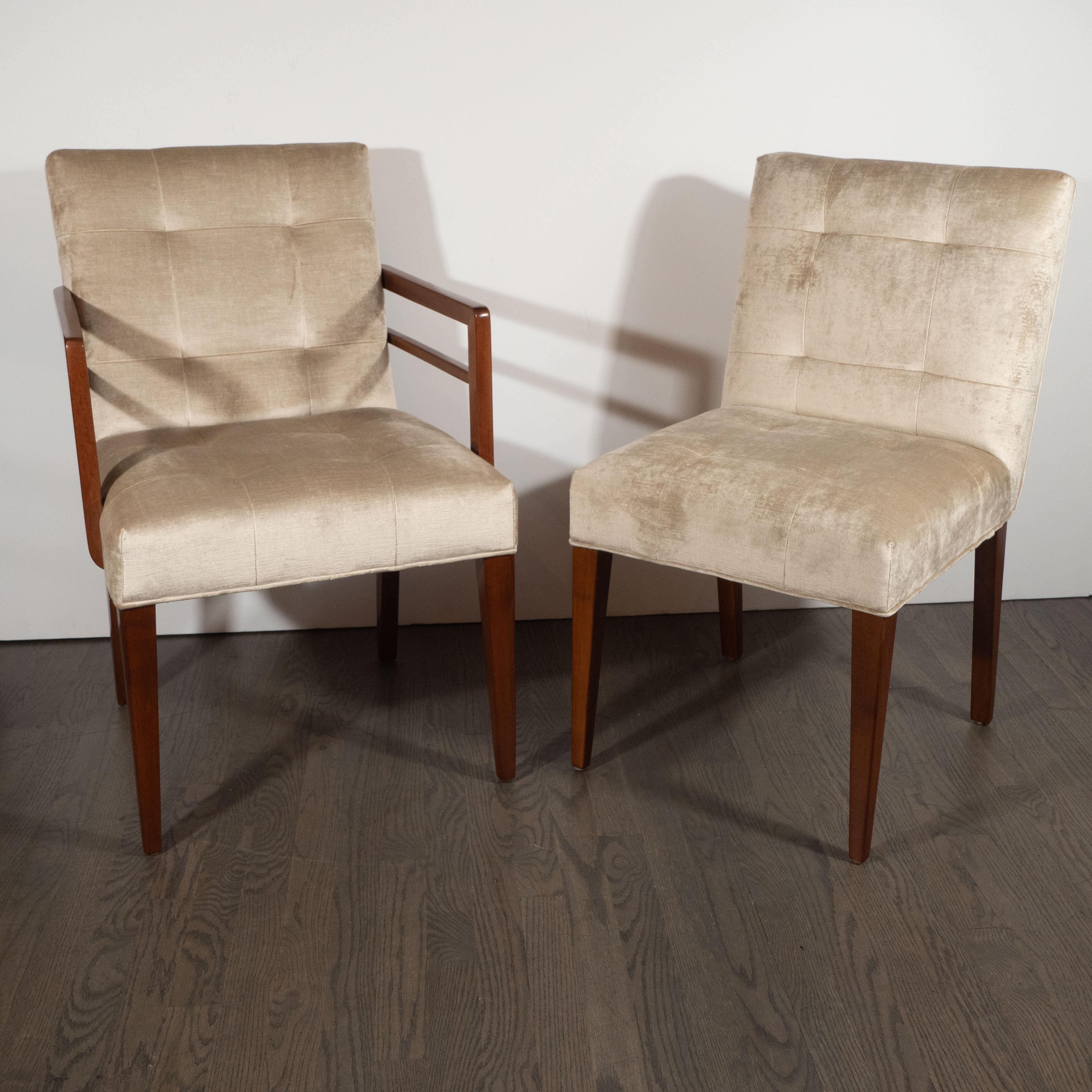 This stunning and important set of eight dining chairs were crafted in the United States by Gilbert Rohde- one of the most influential and celebrated designers of the 20th century, and a forefather of modernism, circa 1940. The set features two arm