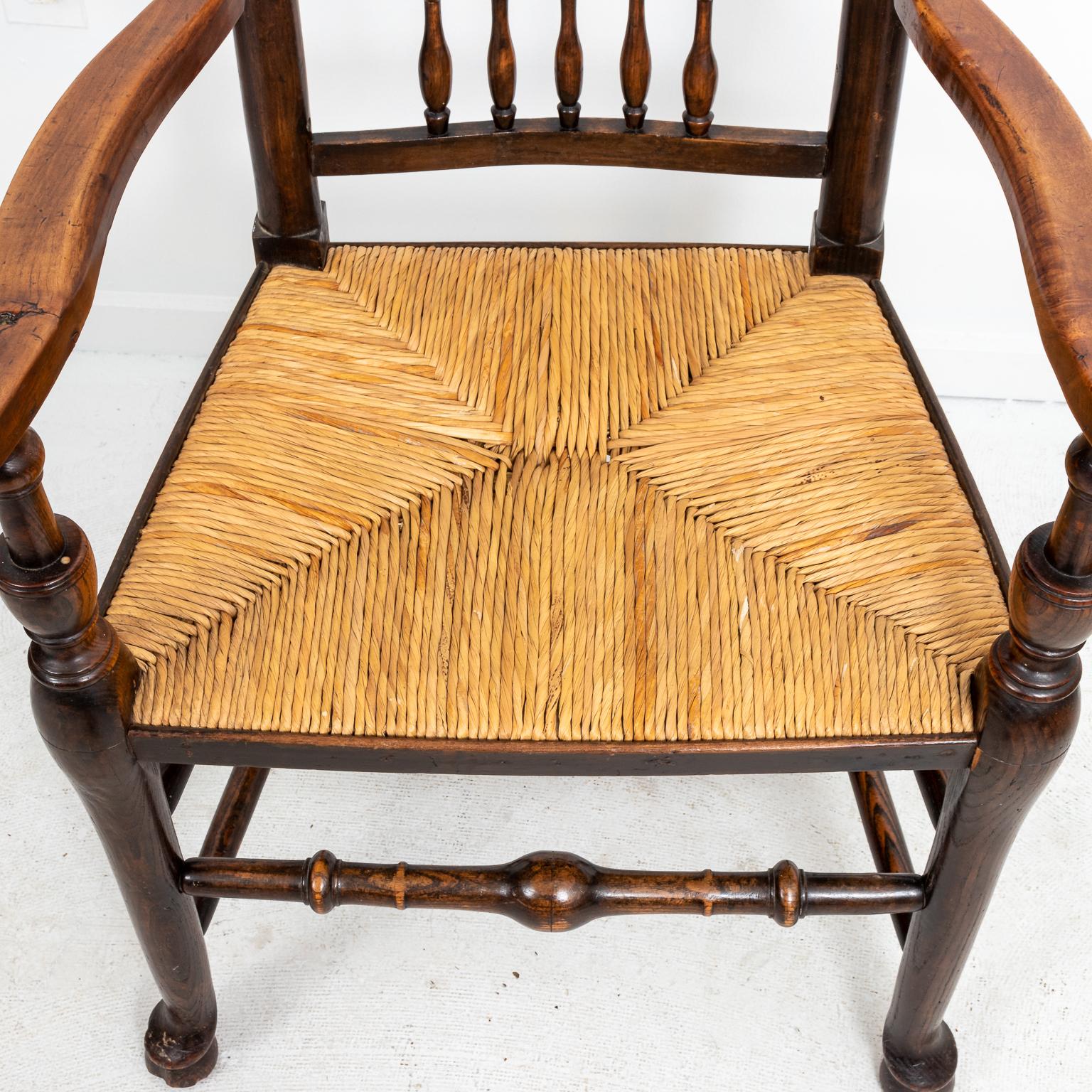 Set of eight banister back dining chairs with turned back rails. Please note of wear consistent with age including finish loss and scratches. The listed measurements are for the side chairs, the armchair measures 22.00 Inches wide with 46.00 inches