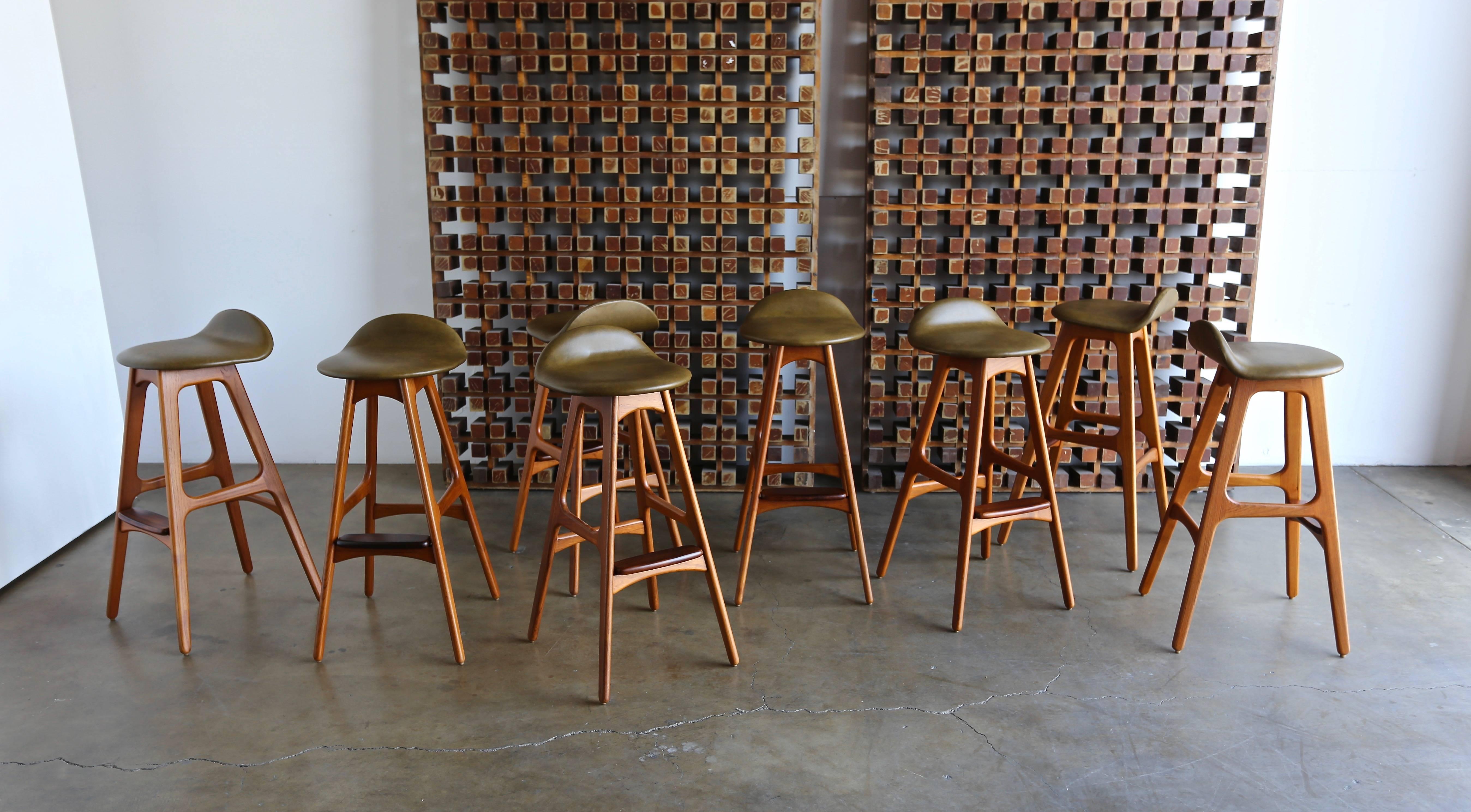 Set of eight rosewood and olive green leather barstools by Erik Buch or Erick Buck for O.D. Mobler, Denmark.