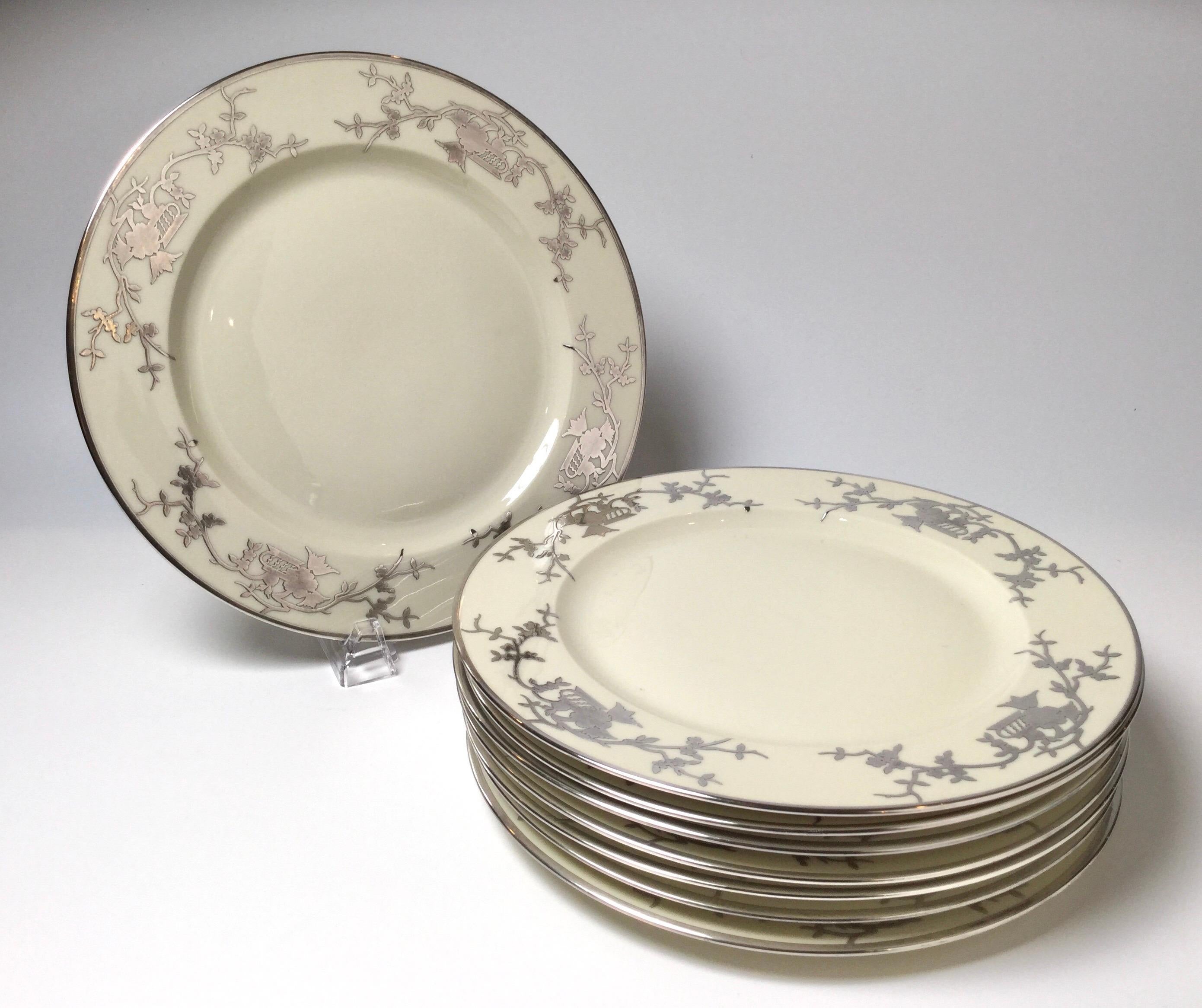 Elegant set off eight Bavarian chinoiserie silver overlay service dinner plates. Each with a chinoiserie sterling overlay decoration. Bavarian circa 1930s. Measure: 10 3/4