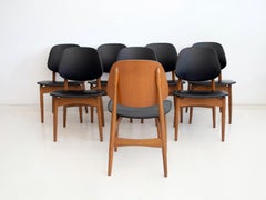Set of Eight Black Faux Leather and Wood Dining Chairs