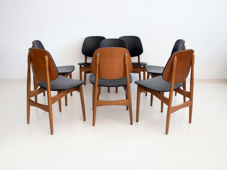 Mid-Century Modern Set of Eight Black Faux Leather and Wood Dining Chairs