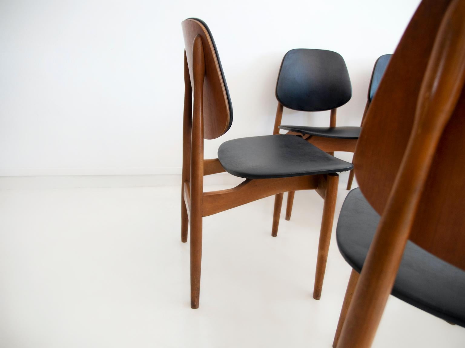 Mid-Century Modern Set of Eight Black Faux Leather and Wood Dining Chairs