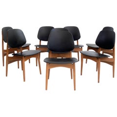 Set of Eight Black Faux Leather and Wood Dining Chairs