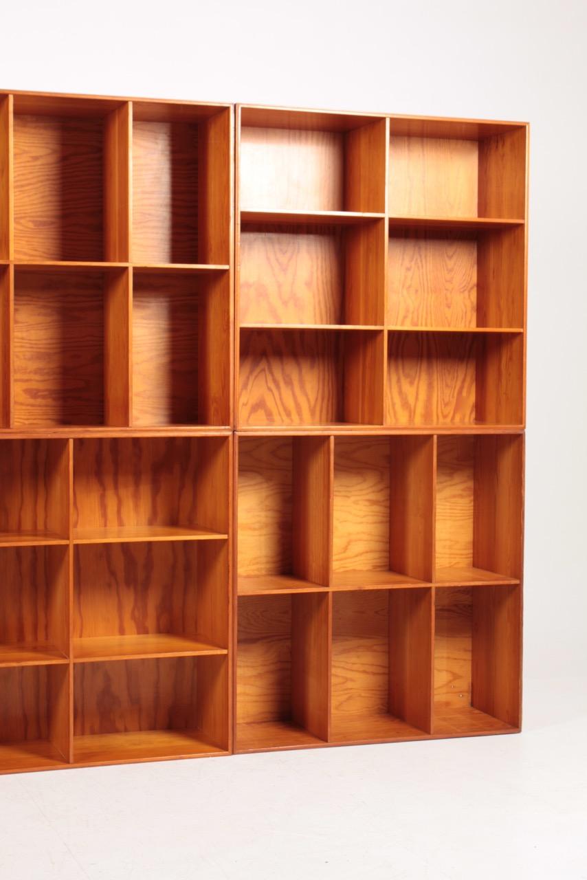 8 matching bookcases in solid pine designed by Mogens Koch for Rud. Rasmussen cabinetmakers in 1933. Made in Denmark and in all original condition.