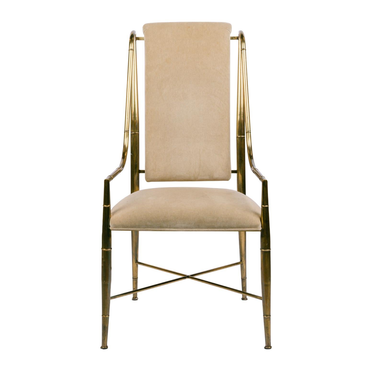 A rare set of 8 timeless solid brass faux bamboo dining chairs purchased in Montreal from the set of one of the first X-Men movies. They were re-upholstered in 8 different but complimentary colored velvet fabric by a local designer for 
a project a