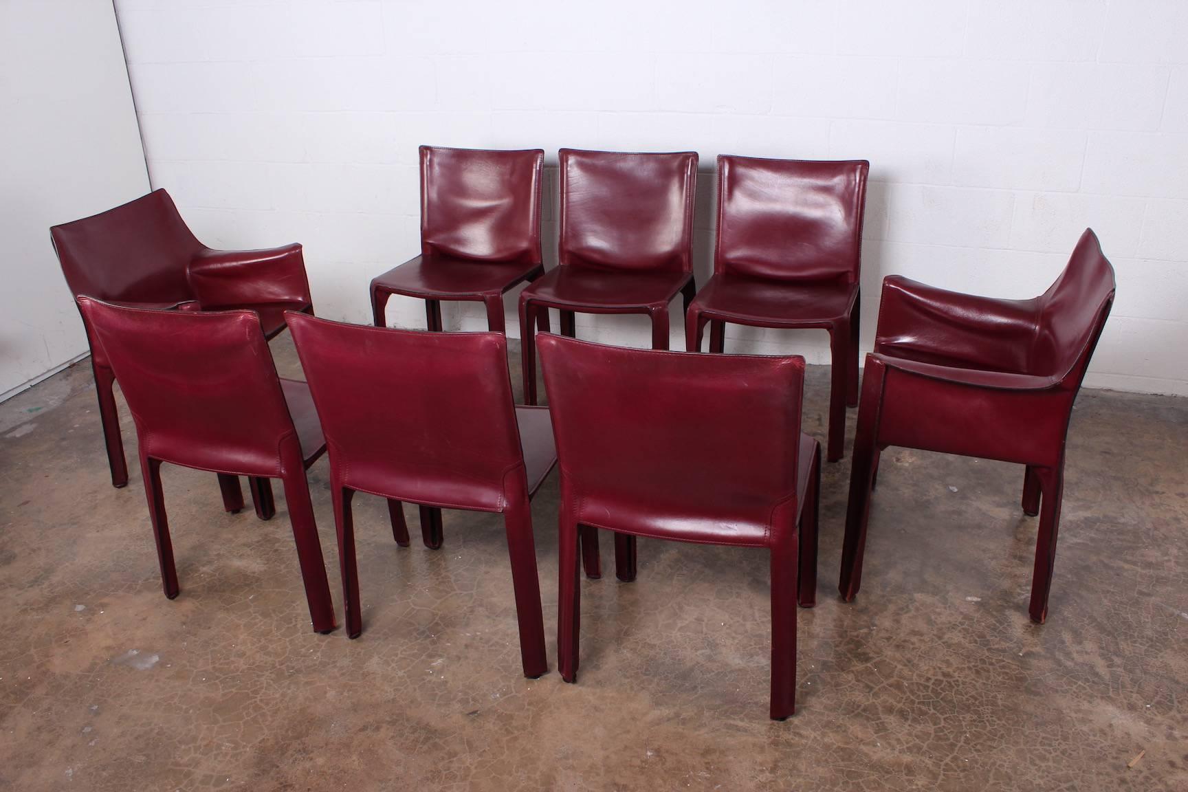 A vintage set of eight Oxblood leather Cab armchairs designed by Mario Bellini for Cassina.
 