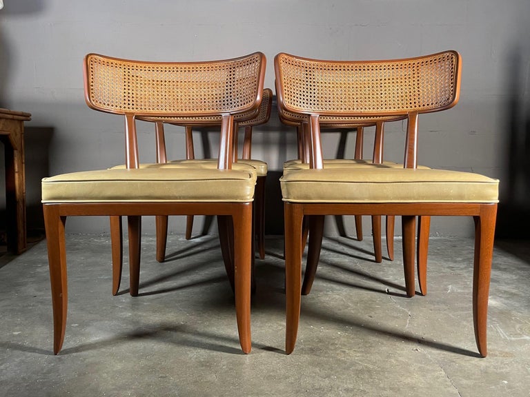 A classic set of eight (8) Dunbar dining chairs designed by Edward Wormley and made by Dunbar ca' 1950's. Large scale with generous seats, klismos style legs and caned backs these chairs are luxurious and elegant. Newly restored and reupholstered in