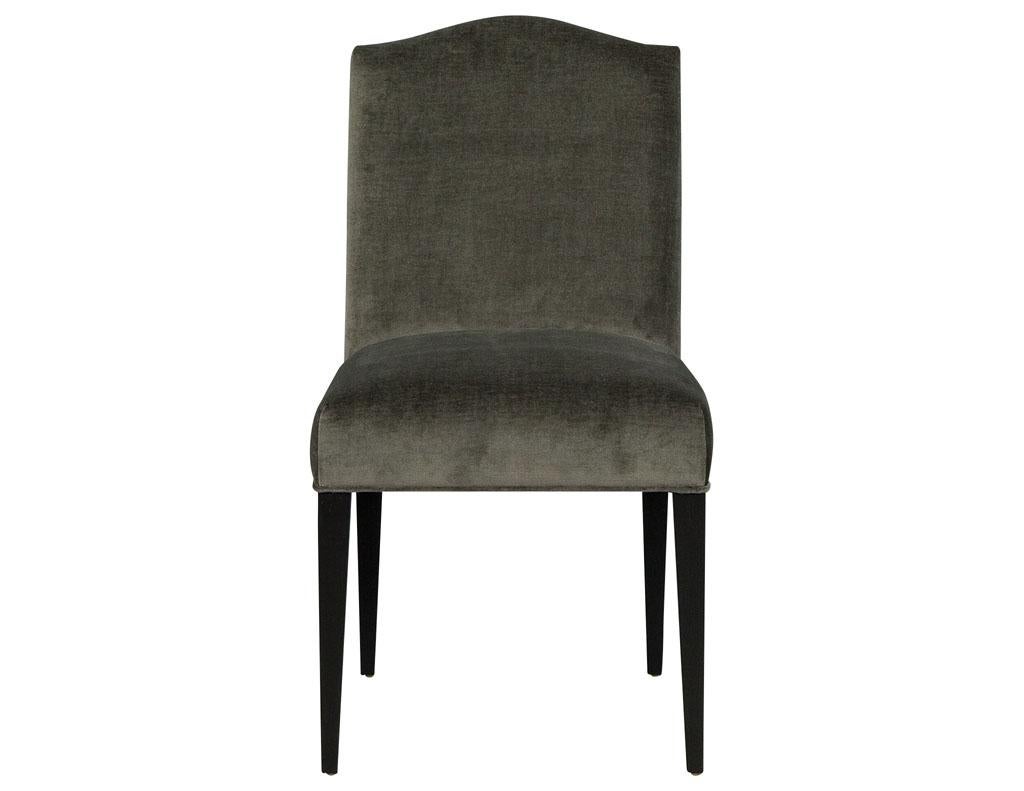 Set of eight Carrocel custom Chameau dining chairs. This transitional style side chair is made to order. Crafted out of solid maple, this side chair has a decorative backrest covered in a dark grey velvet upholstery that is connected to the seat. An