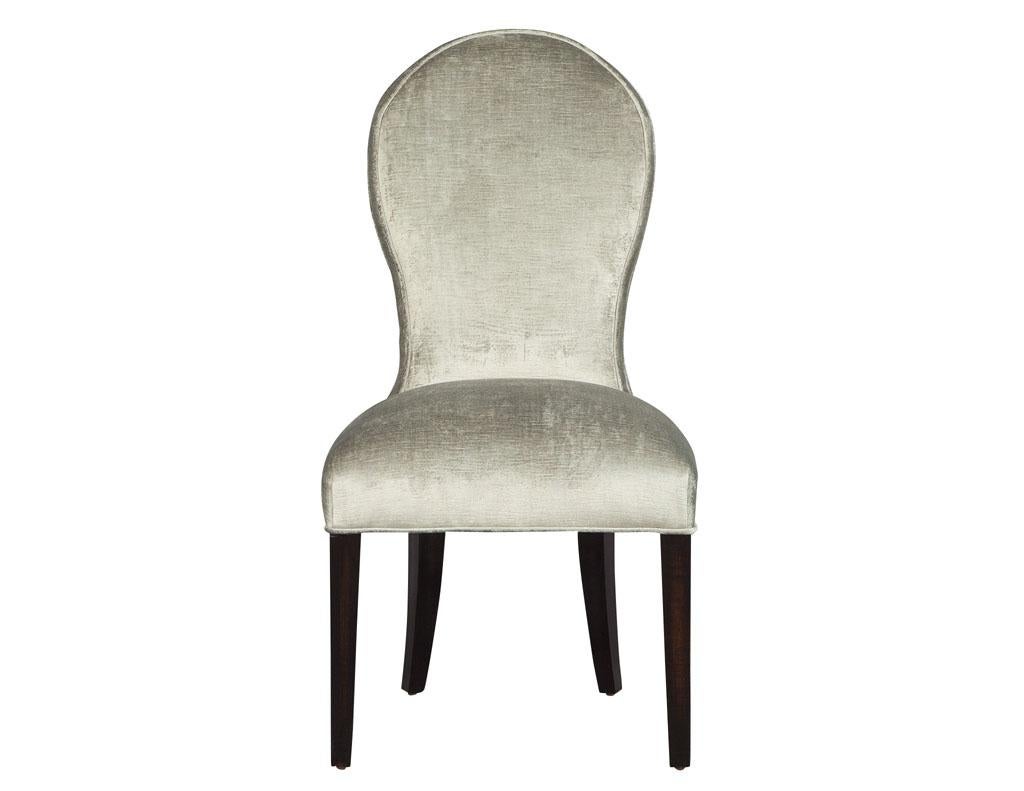 The spoon back chair is a contemporary design that fits a multitude of interior designs. Featuring a sculpted curved spoon back design, with a tapered straight leg makes for a visually sleek and slender. Each frame is handcrafted solid wood and