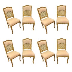 Set of Eight Carved and Caned Painted Dining Chairs