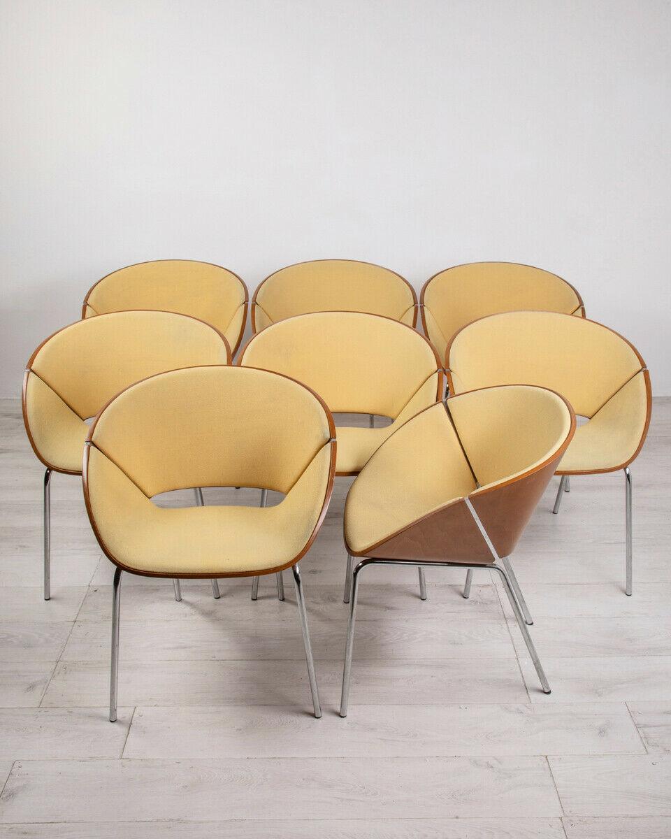 Set of eight chairs with structure and central bar in chromed steel, body in curved wood and seat upholstered in yellow fabric. Lipse model, design Wolfgang C.R. Mezger for Walter Knoll, 1990s.

Condition: In good condition, they may show slight
