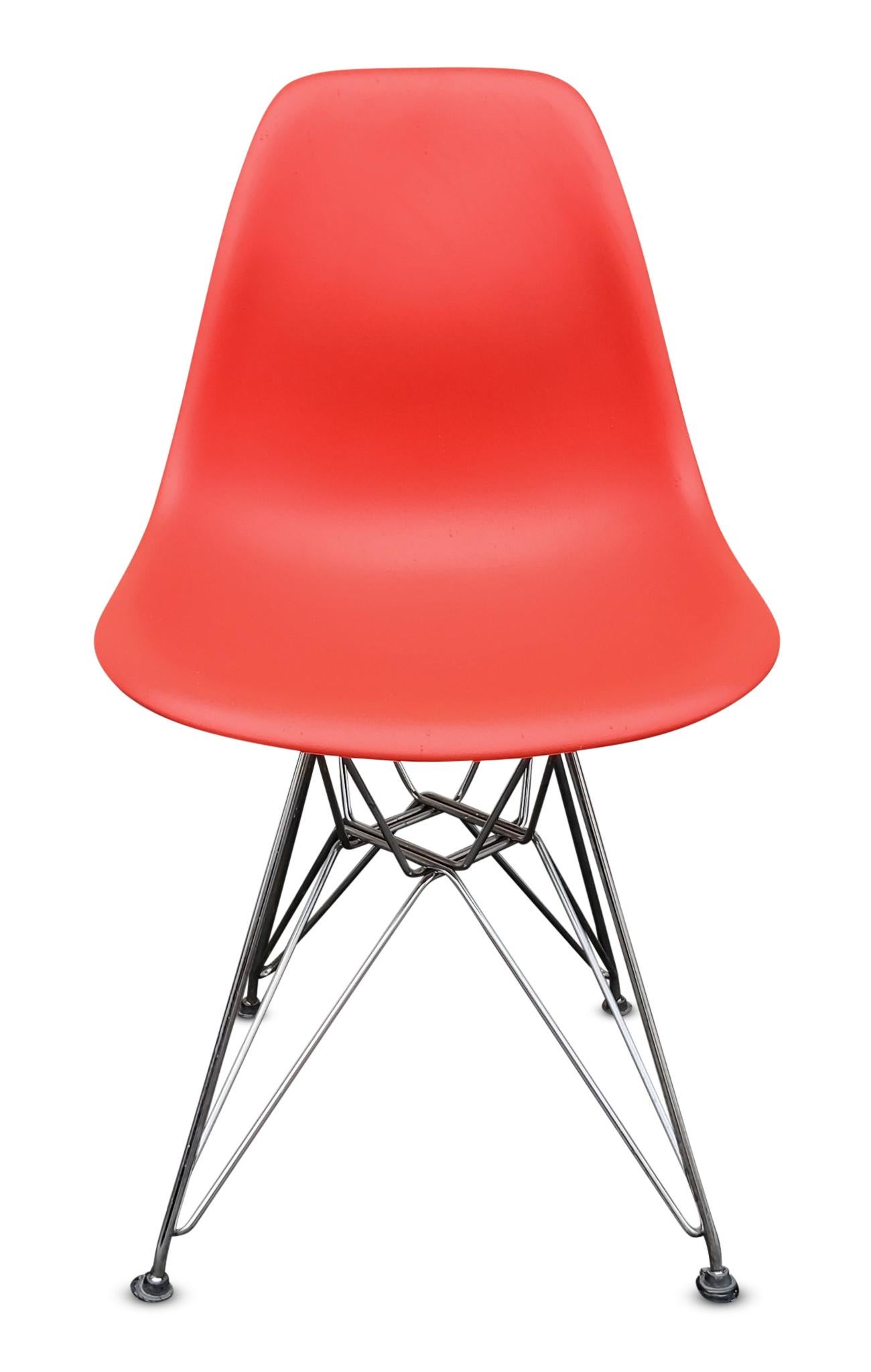This set of eight chairs was designed by Charles Eames for Herman Miller. This chair and its various designs has seen long-lasting success and adoration, and these chairs are no different. The polycarbonate shells are hot pink, almost bright orange.