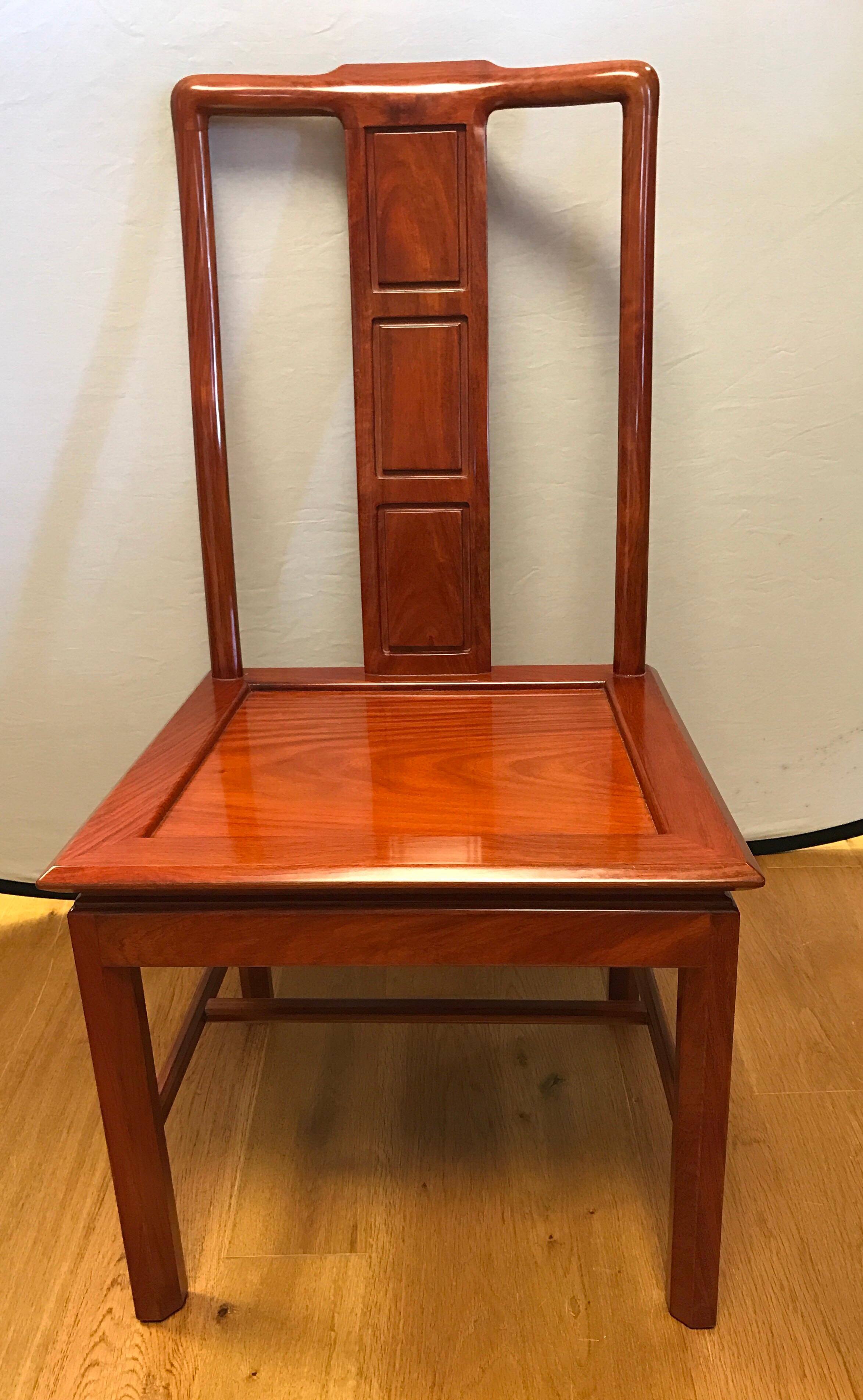 Magnificent set of eight Chinese brown rosewood chairs, of which two are armchairs and six are side chairs. Mint condition.